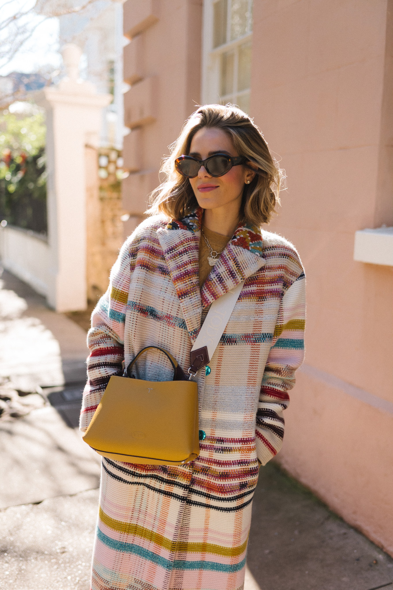 rainbow striped coat gold sweater pink flared pants