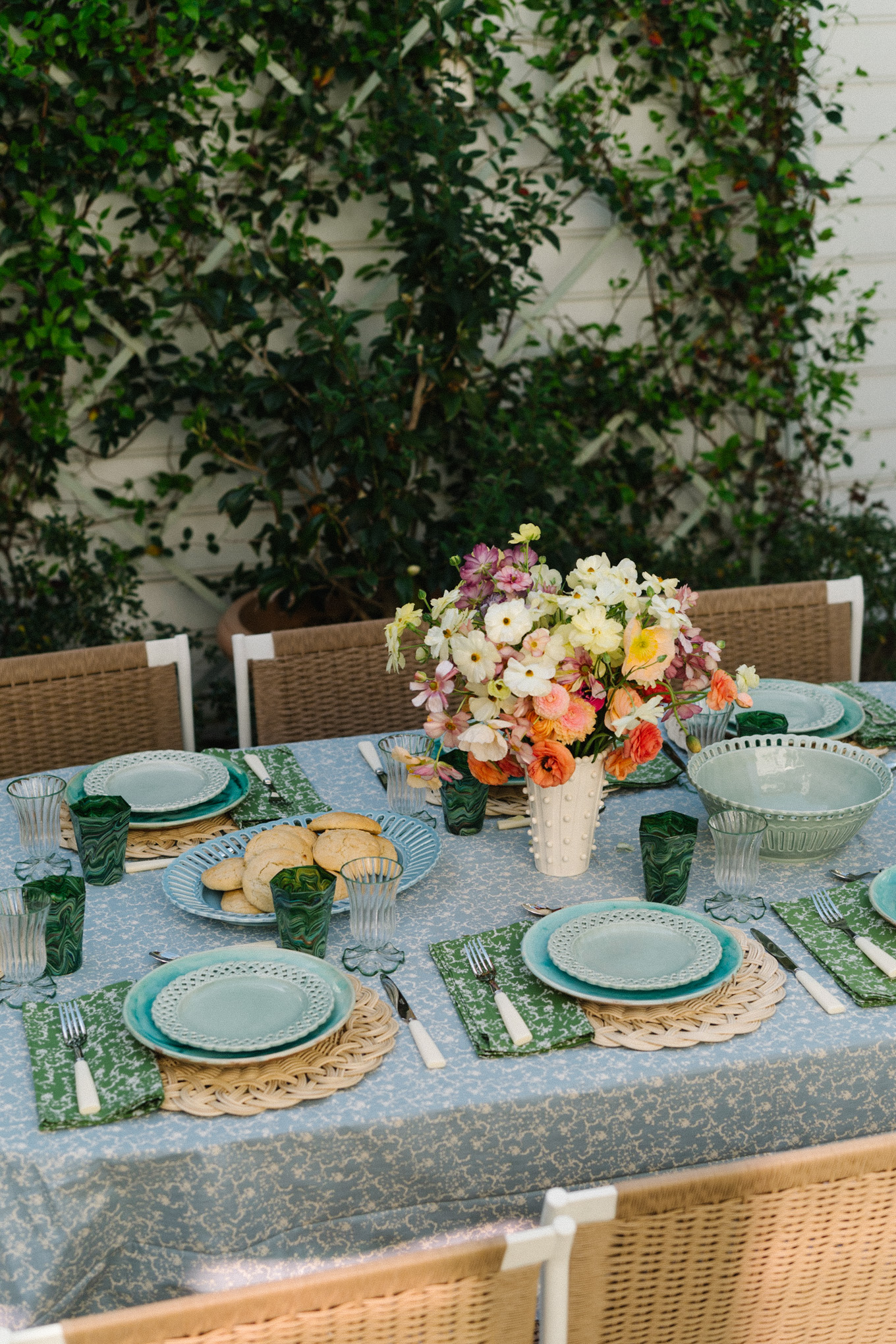 spring tablescape blue floral tablecloth blue and green tableware