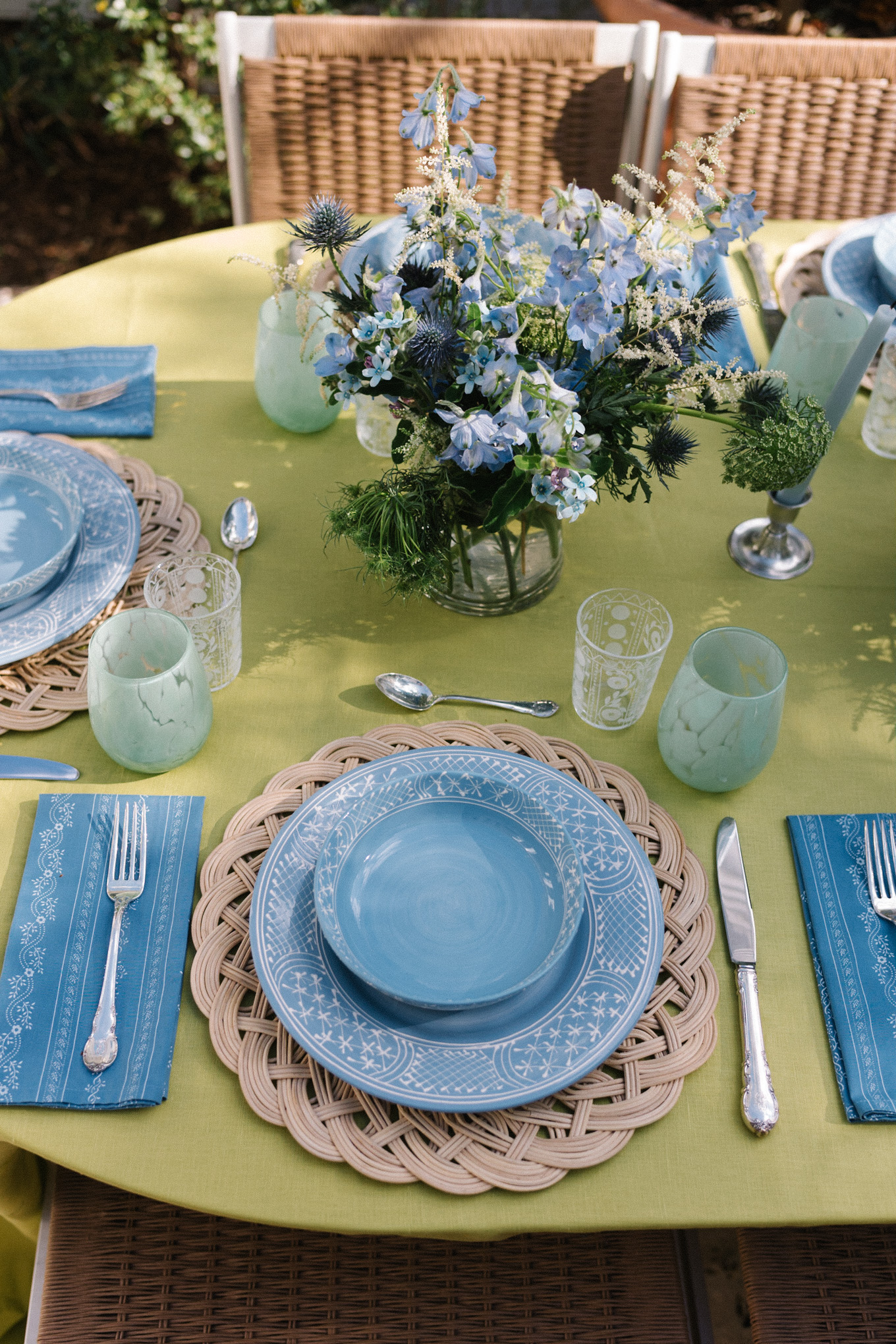 spring tablescape chartreuse green tablecloth blue tableware