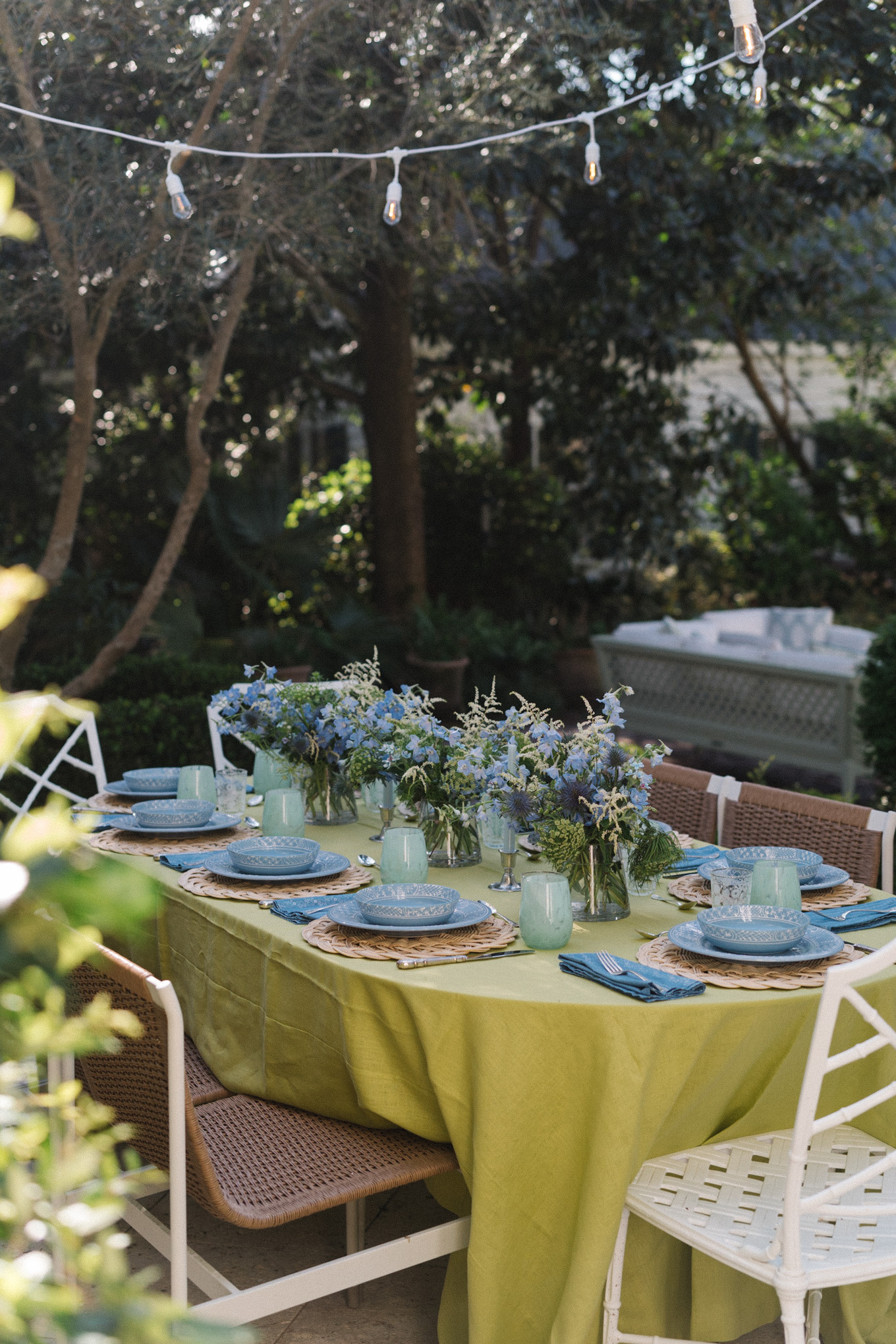 spring tablescape chartreuse green tablecloth blue tableware