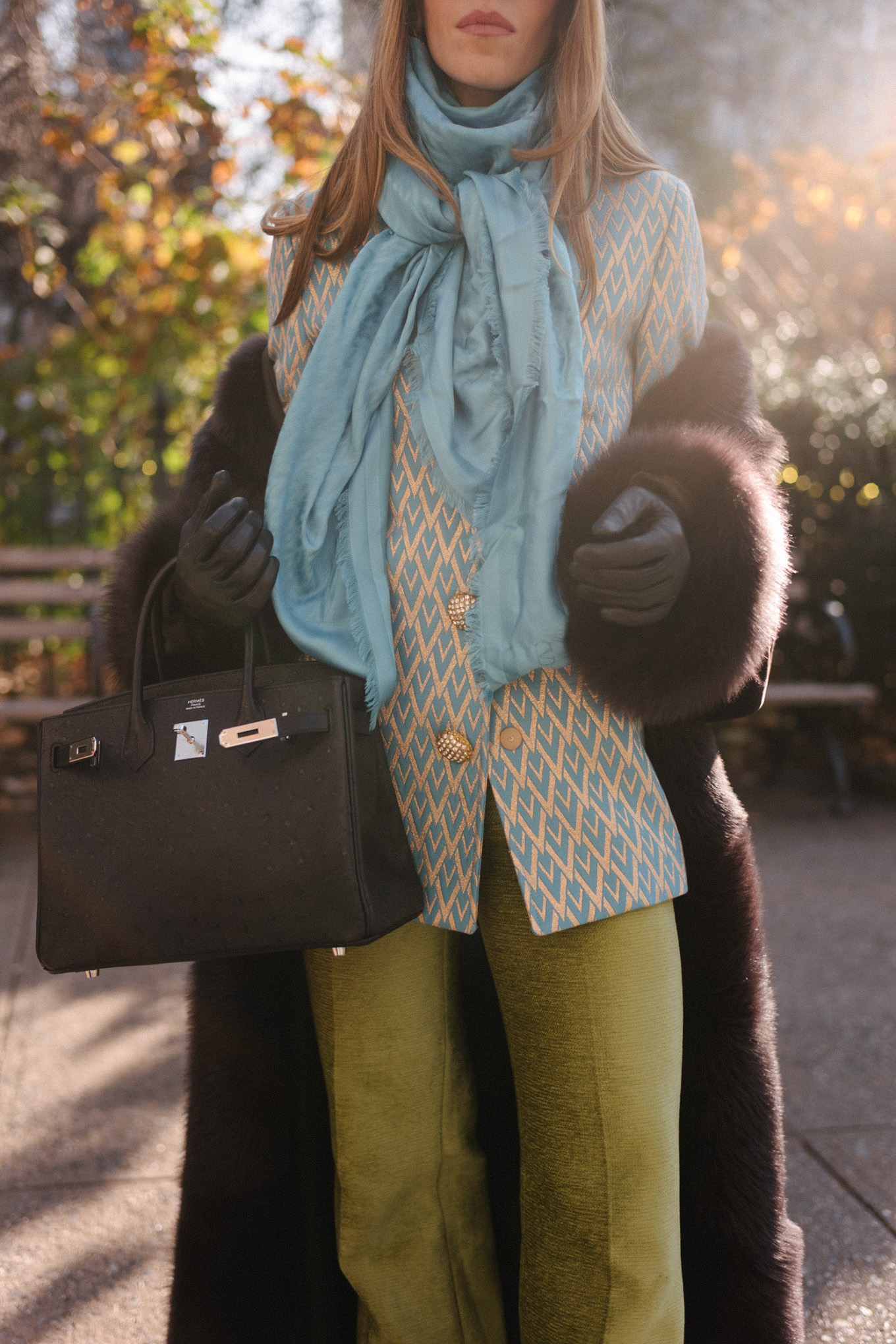 brown shearling coat leopard pill box hat green satin pants turquoise silk scarf