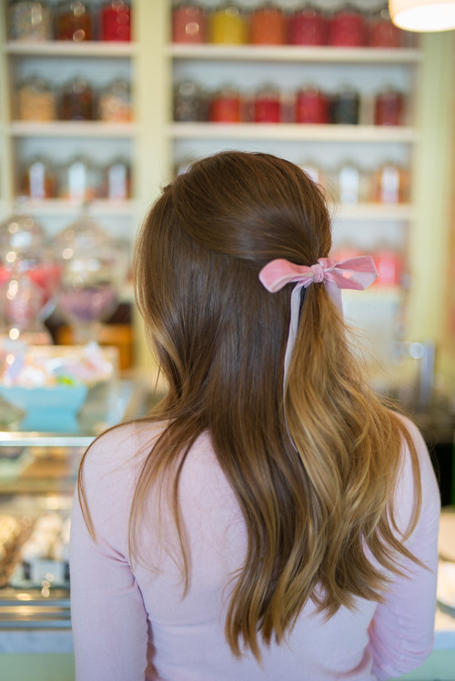 Pink ribbon in hair