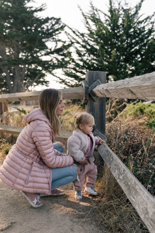 pink sneakers pink coat jeans