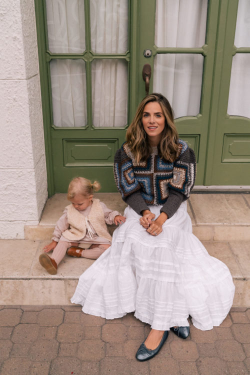 brown blue sweater white skirt