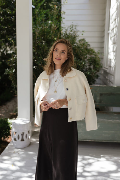 cream buttoned jacket white blouse black maxi skirt