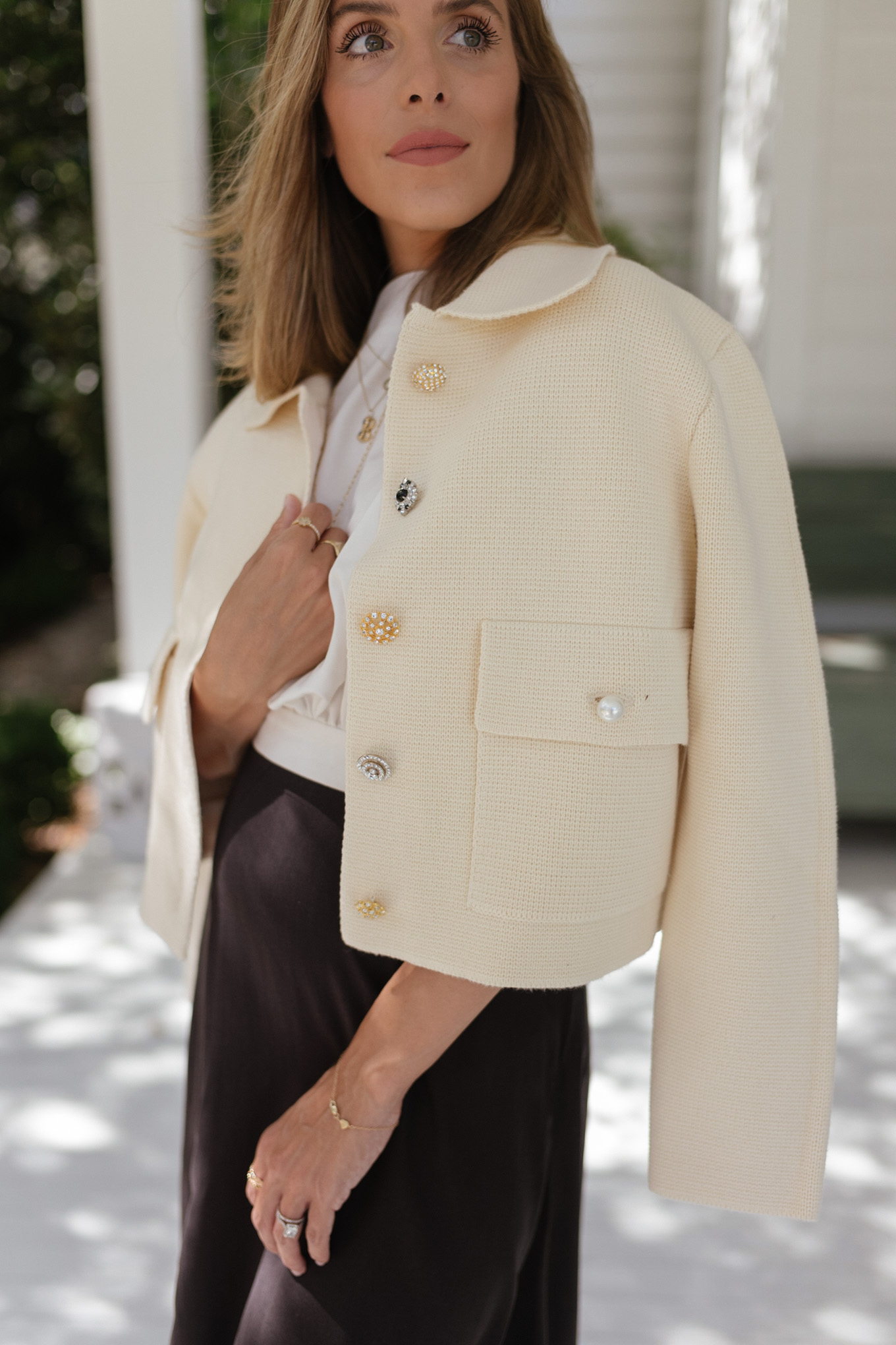 cream buttoned jacket white blouse black maxi skirt
