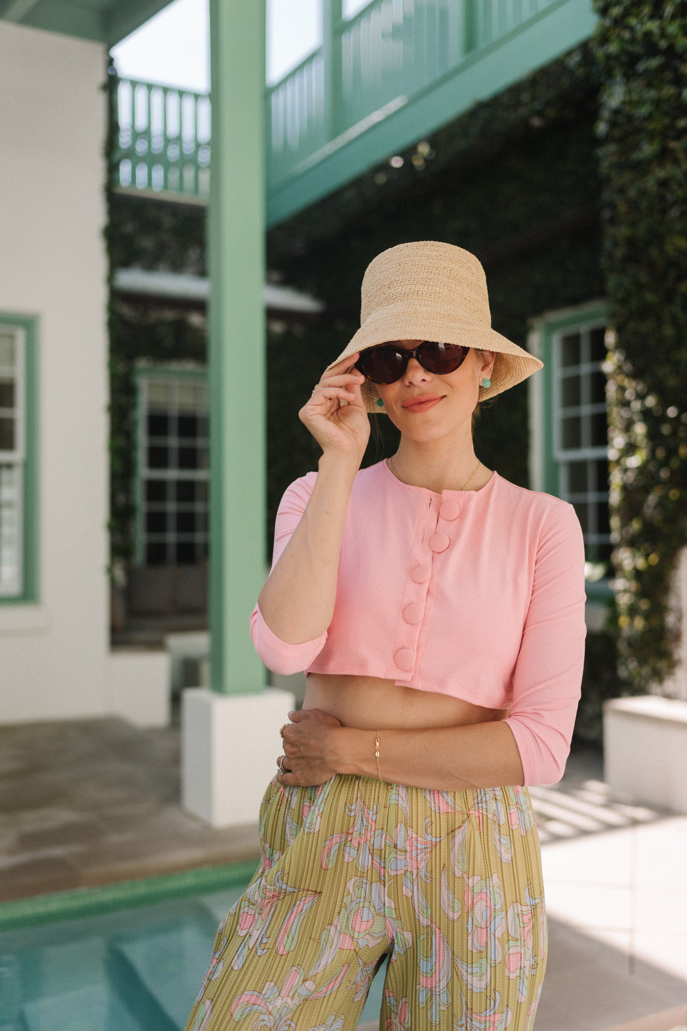 pink buttoned bikini and cardigan straw hat