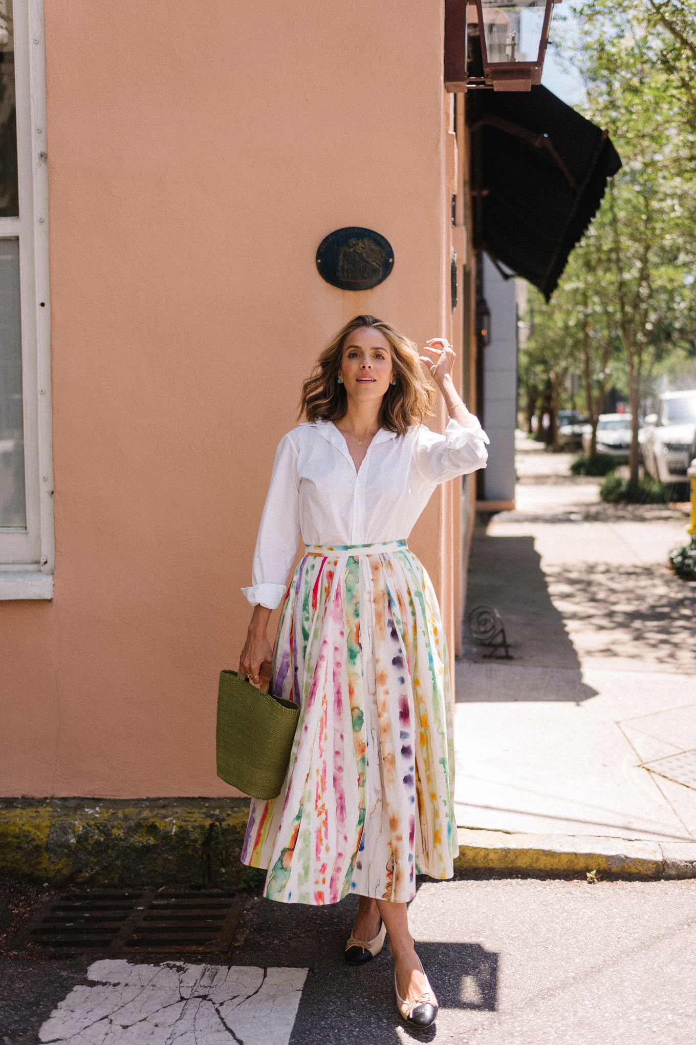 white blouse colorful skirt