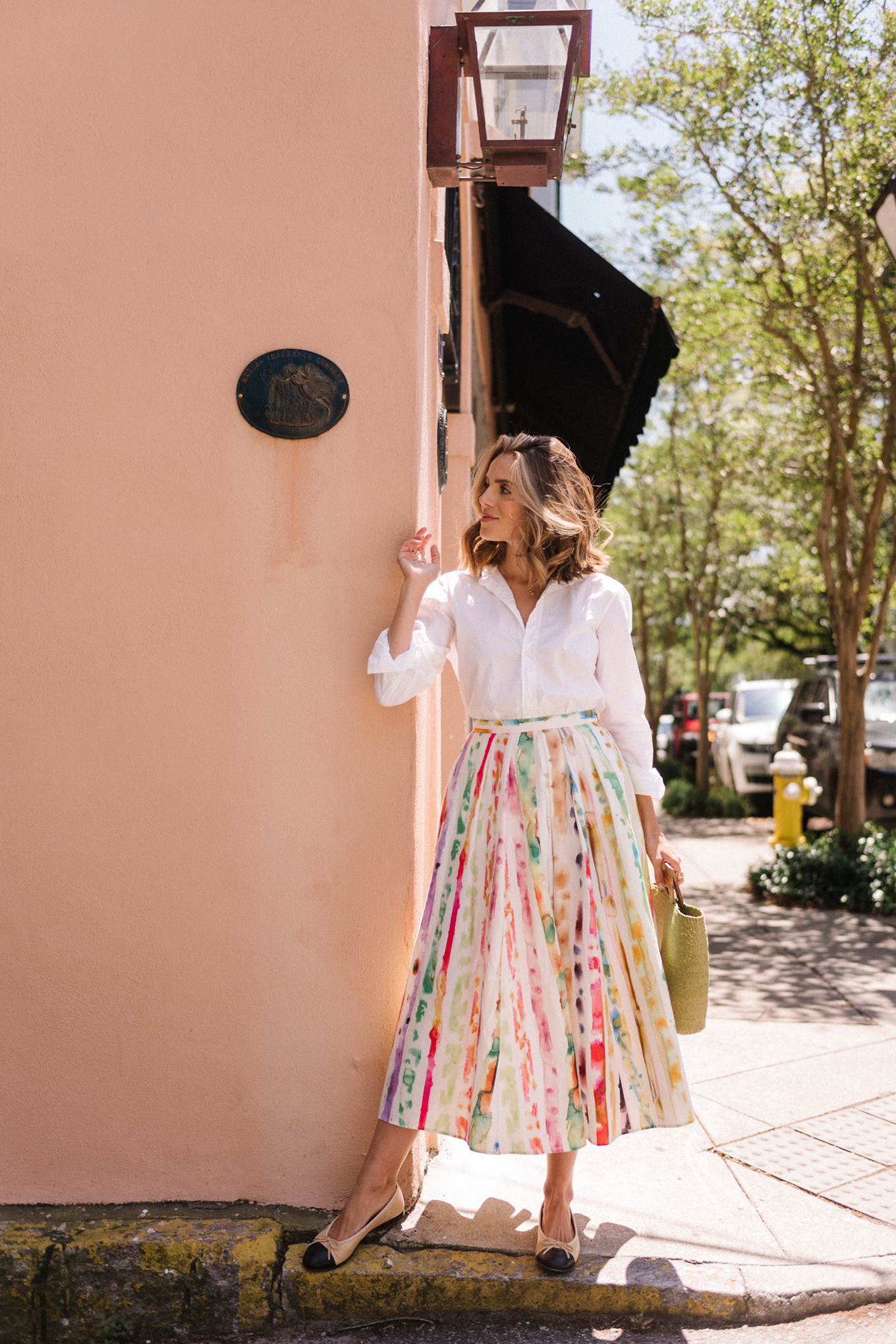 white blouse colorful skirt