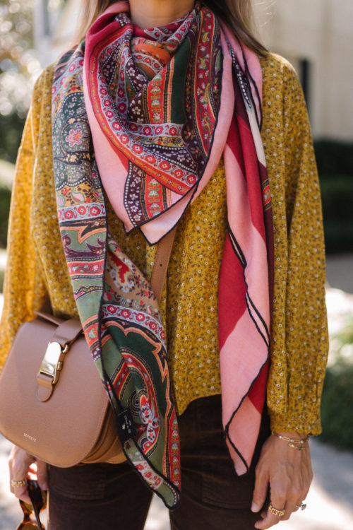 gold blouse pink silk scarf brown cords brown leather bag