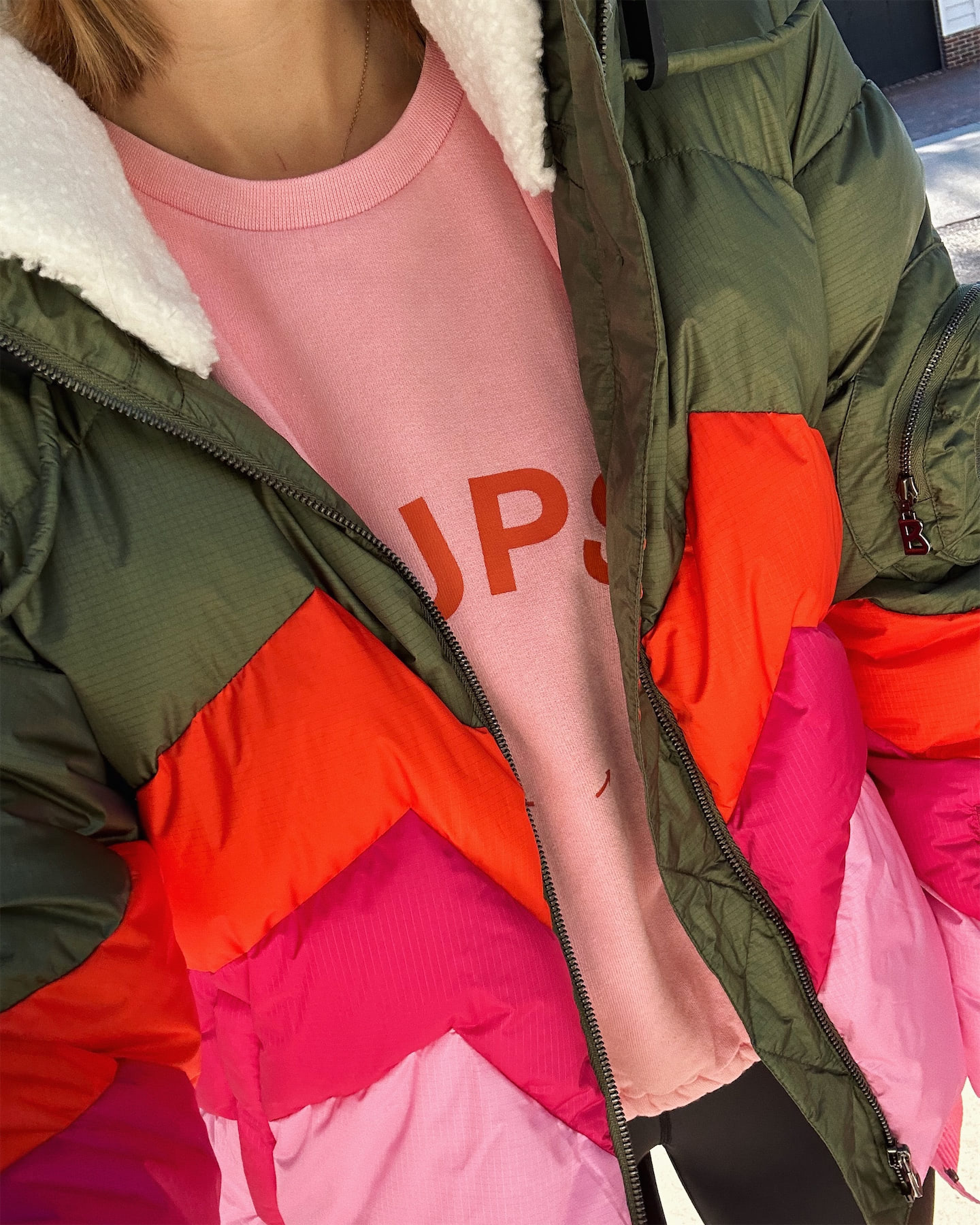 green pink red puffer jacket