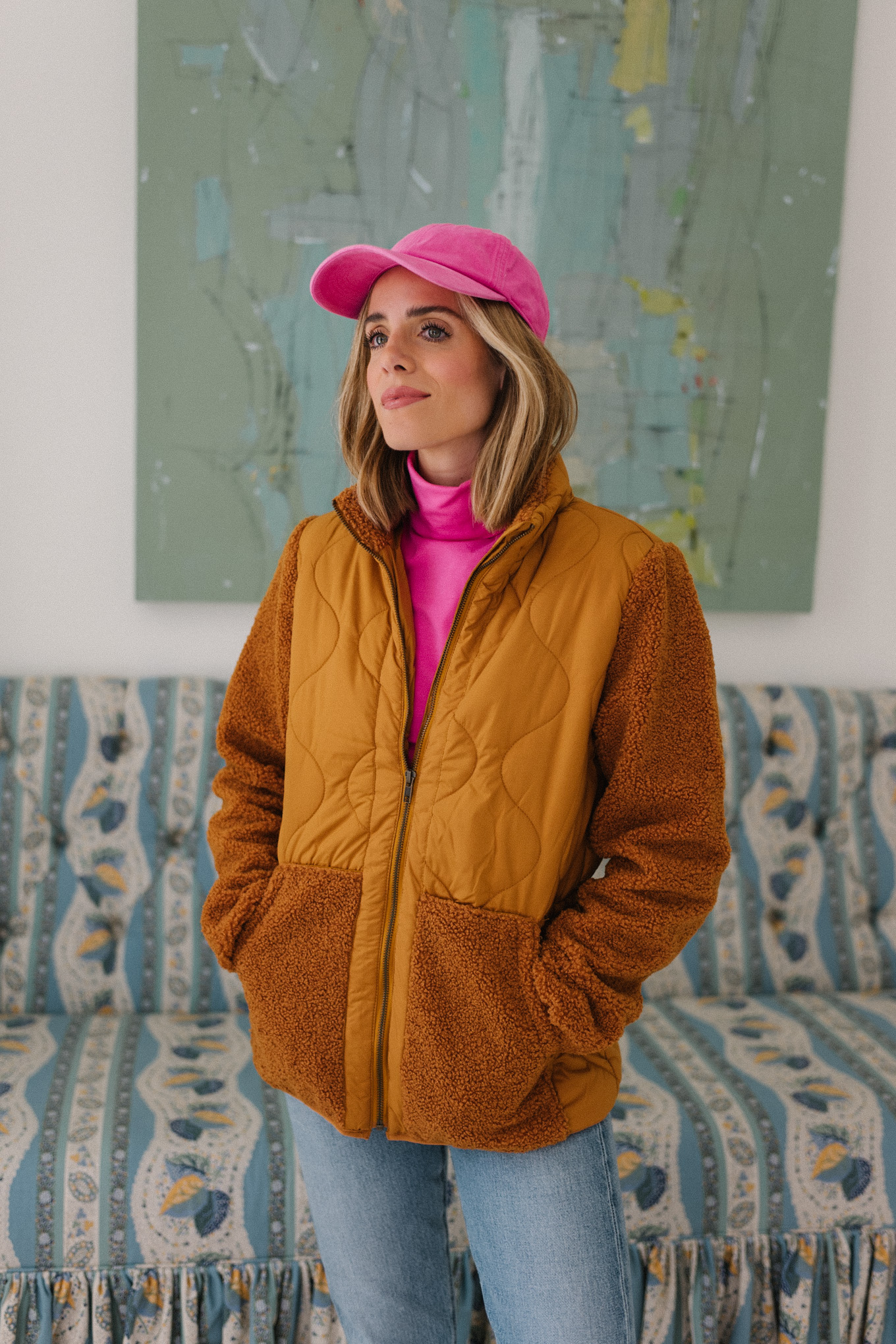 orange fleece jacket pink turtleneck pink hat