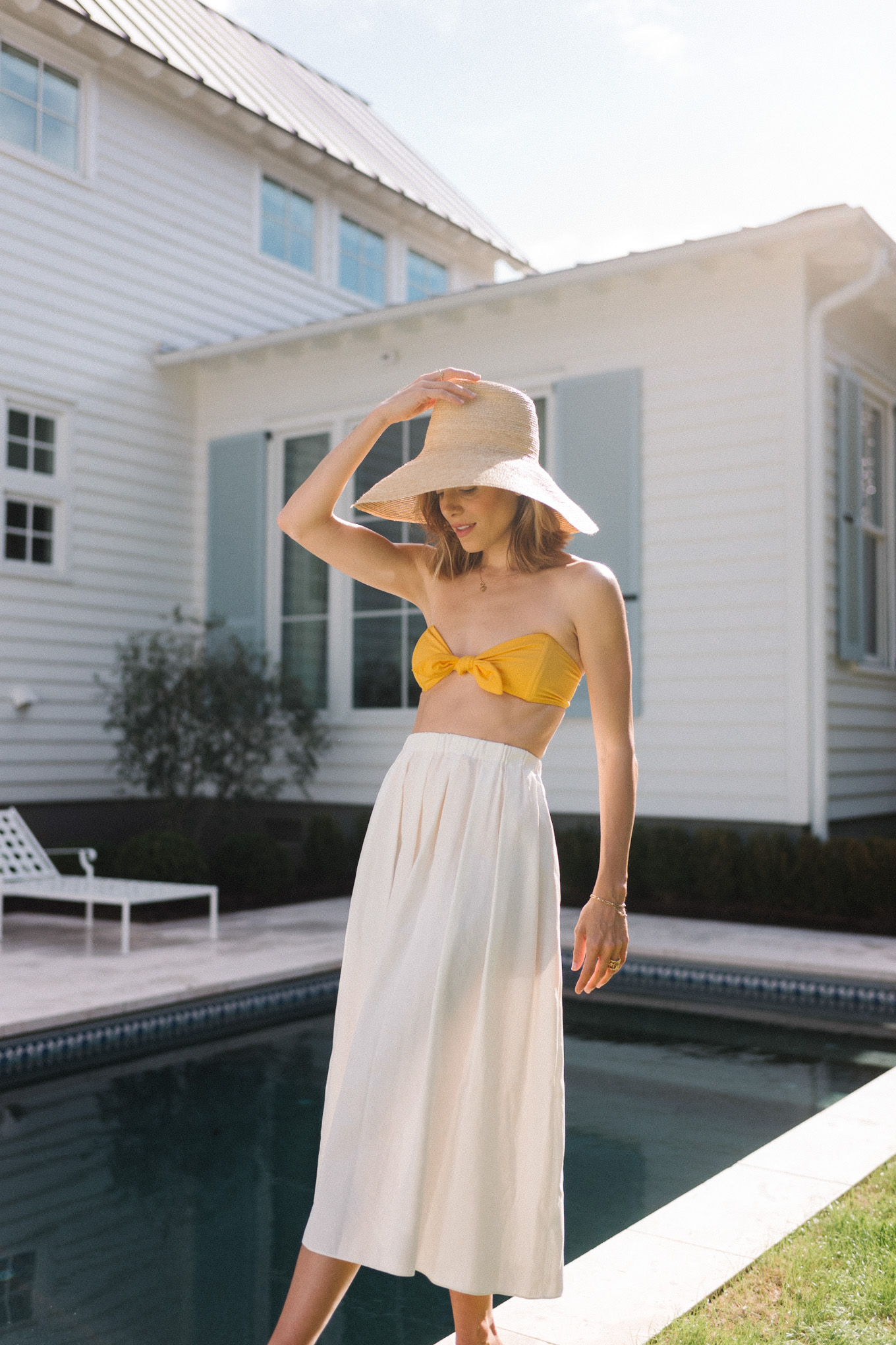 yellow bikini white skirt straw hat