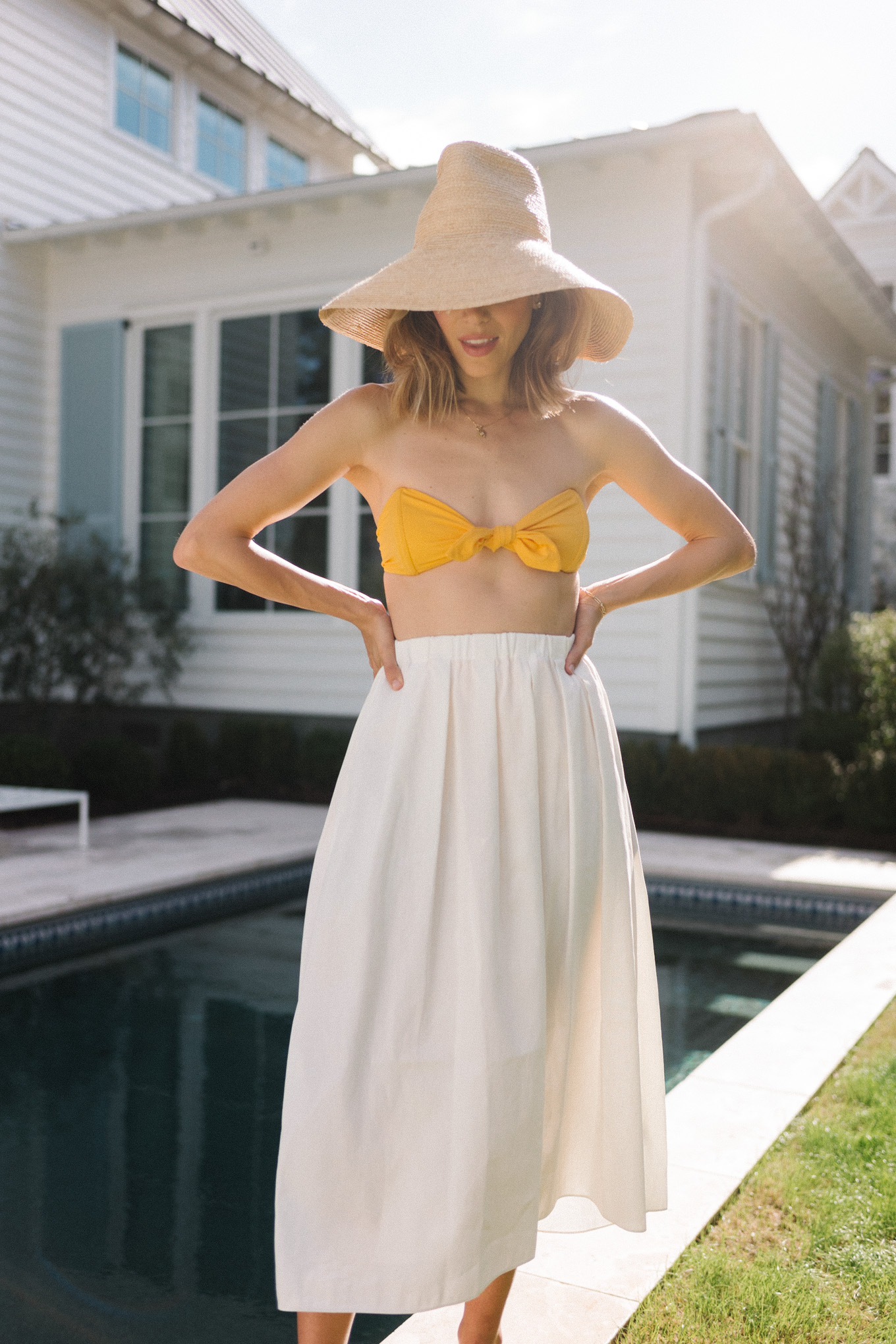 yellow bikini white skirt straw hat