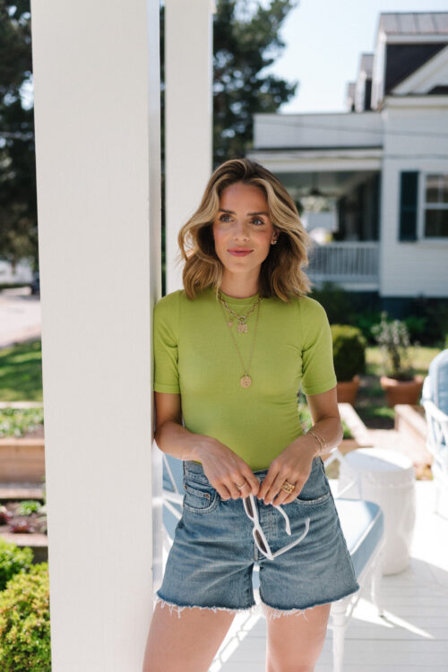green tee blue denim shorts