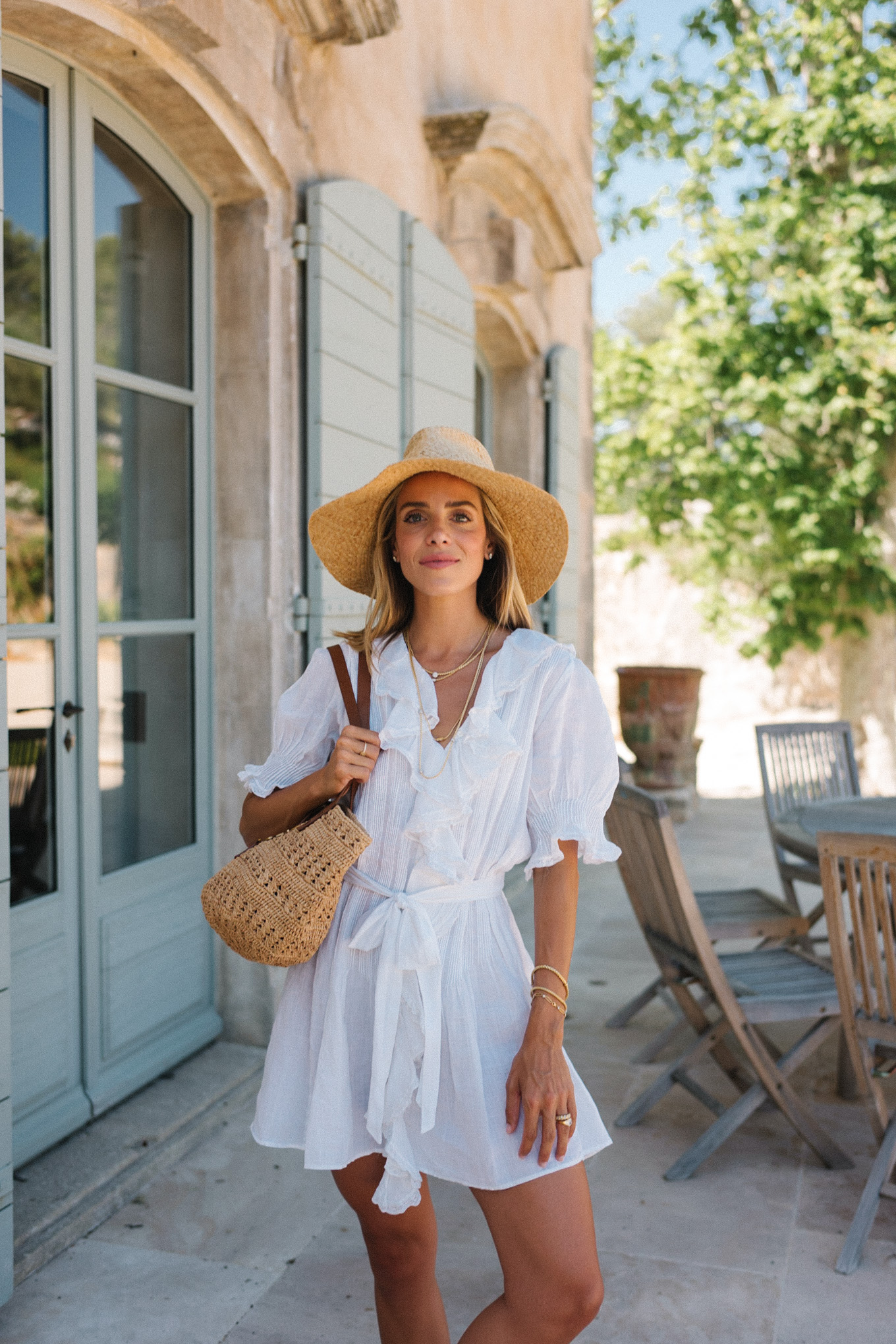 white belted ruffled minidress straw hat straw bag