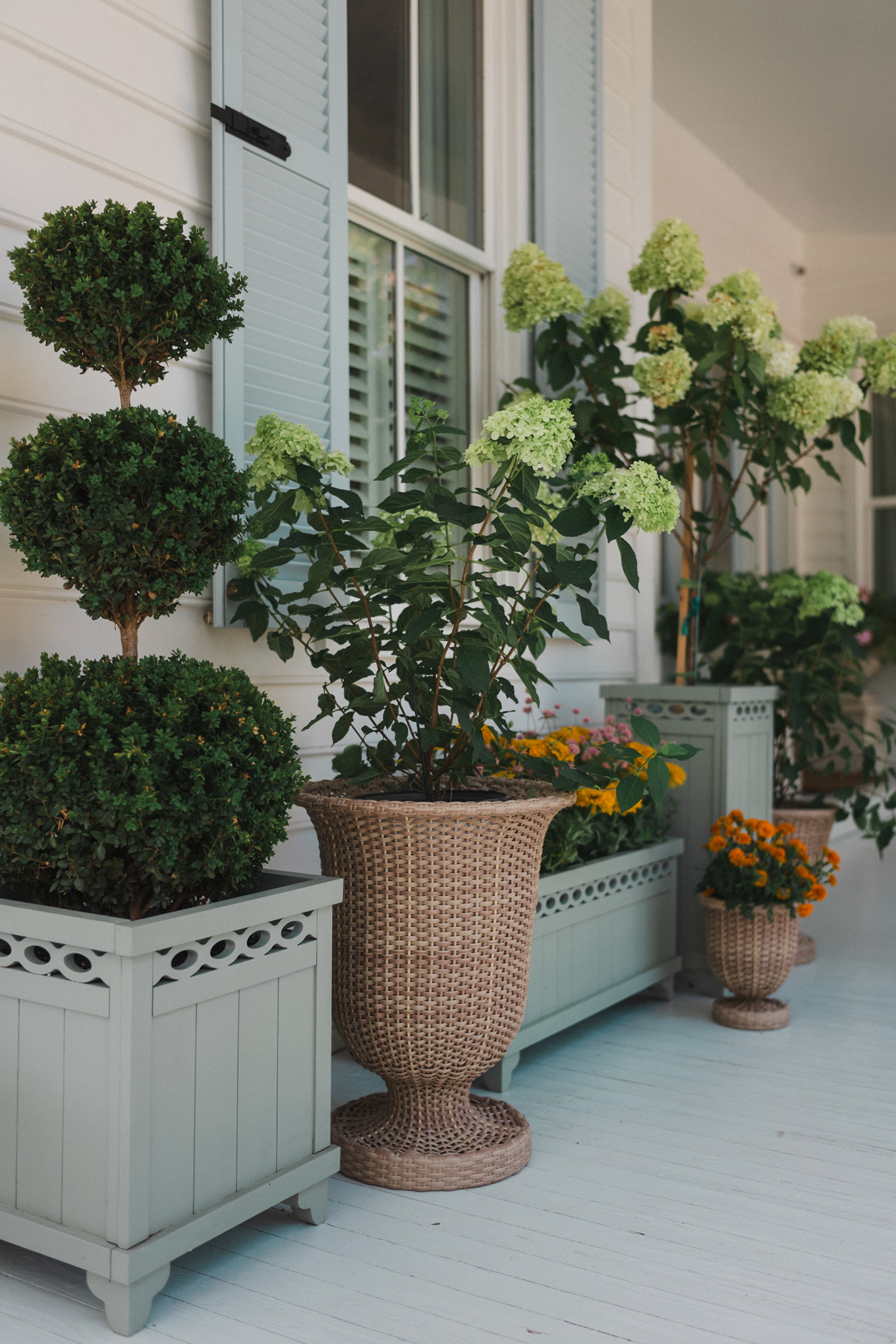 green and woven outdoor planters