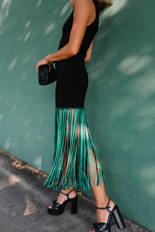 black sleeveless dress green fringe trim