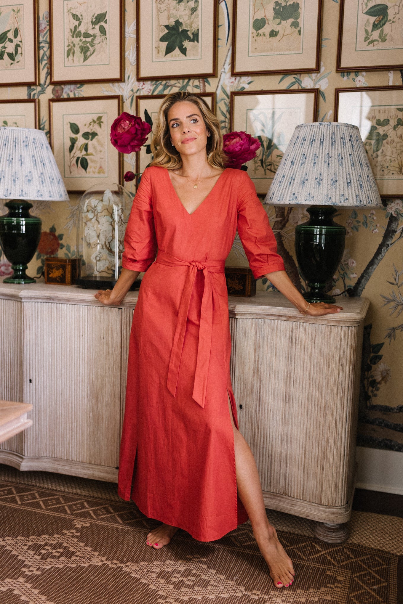 red long sleeved belted dress