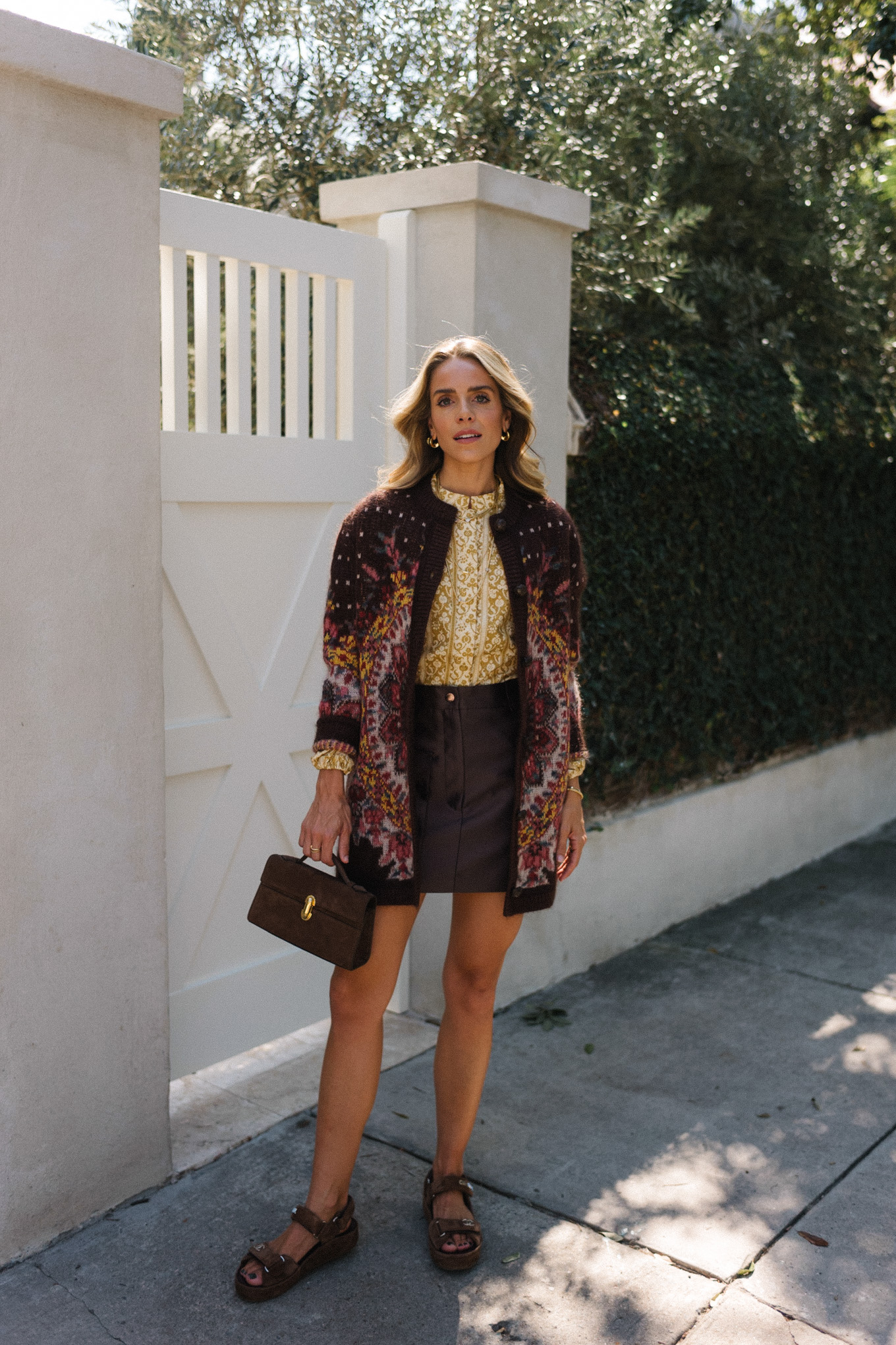 Maroon floral cardigan gold blouse leather skirt