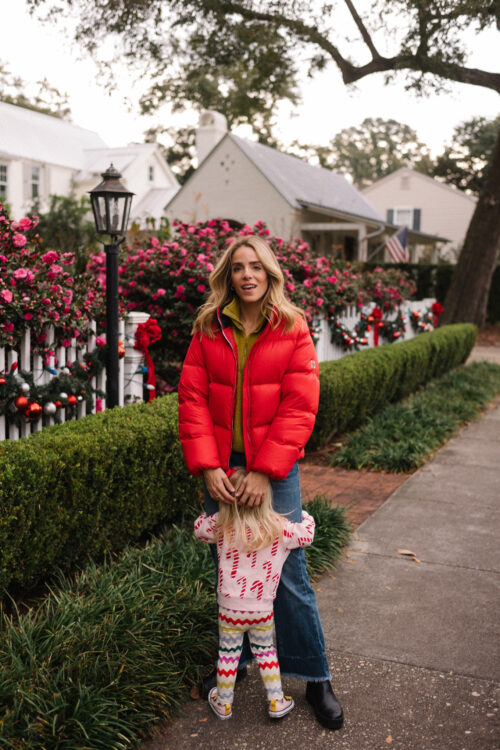 red puffer coat gold sweater blue denim