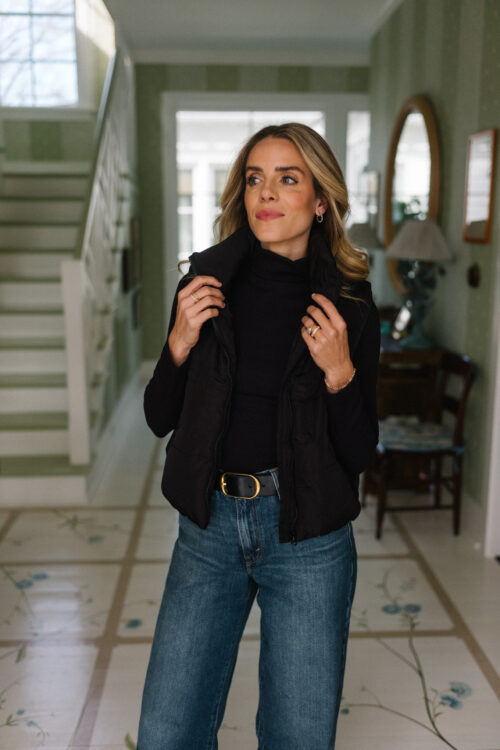 blue denim black sweater black puffer vest