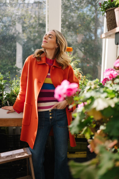 red orange coat striped colorful sweater blue denim