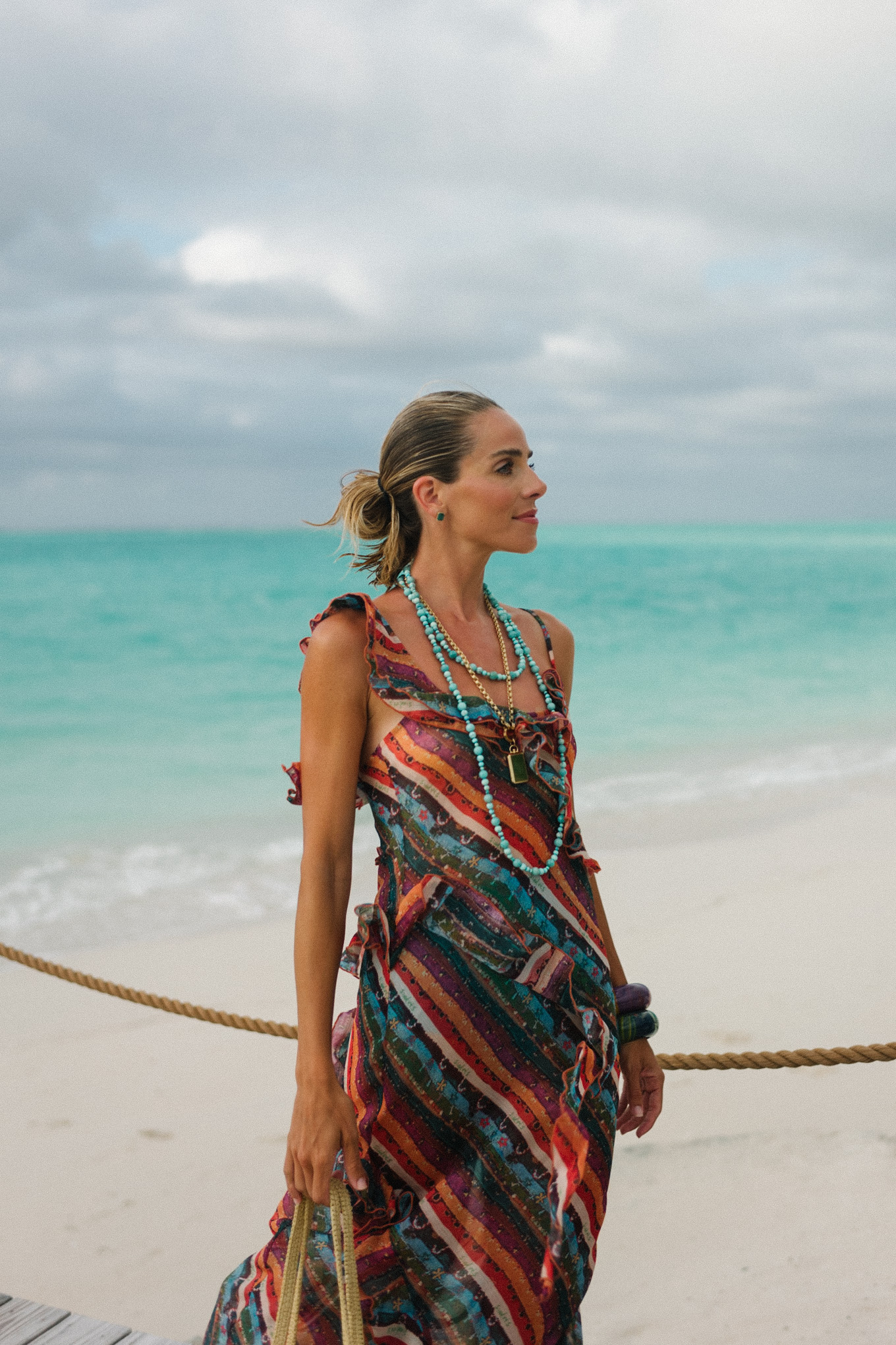 rainbow stripe ruffle maxi dress turquoise bead necklace woven bag