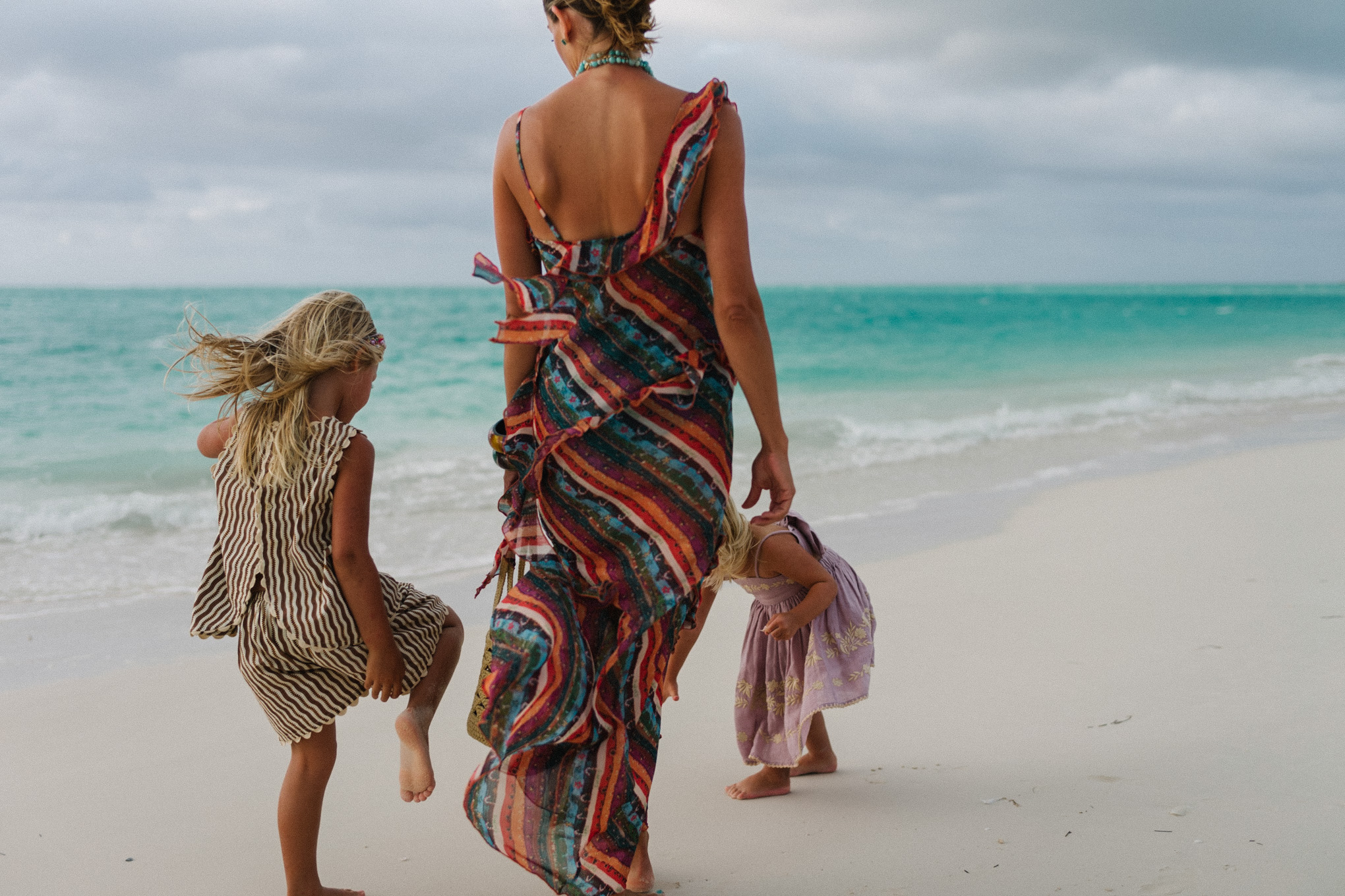 Rainbow stripe ruffle maxi dress turquoise bead necklace woven bag