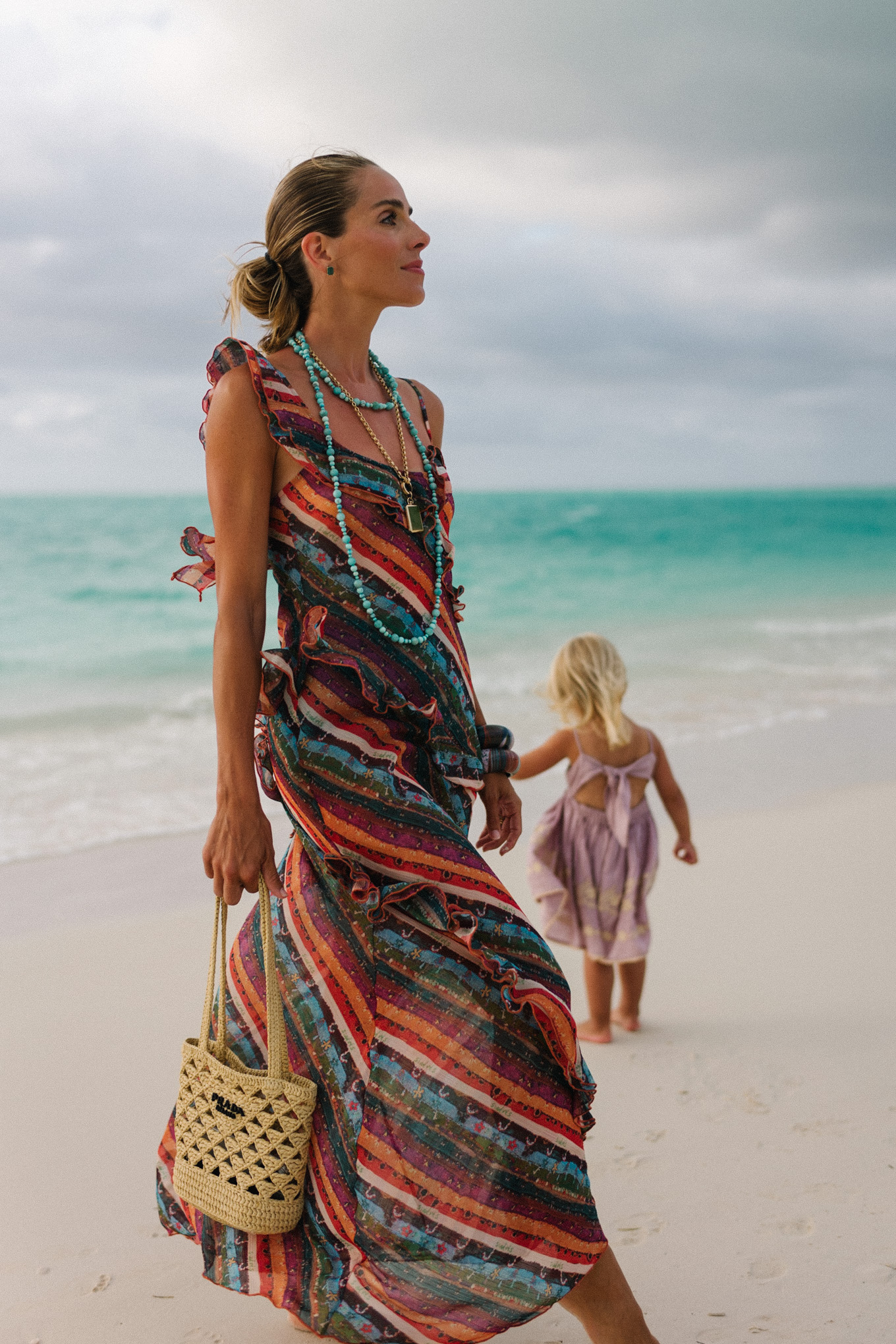 Rainbow stripe ruffle maxi dress turquoise bead necklace woven bag