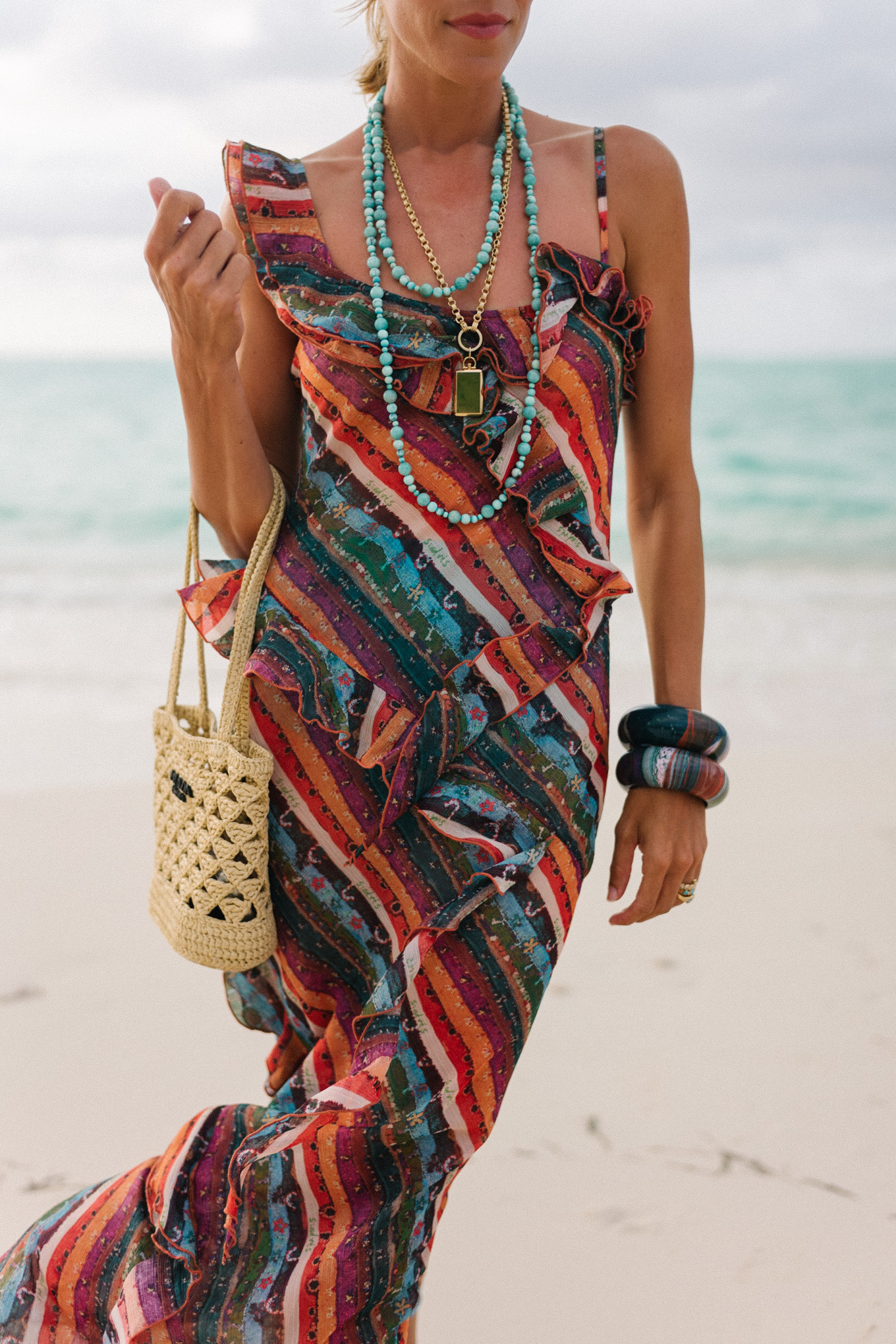 Rainbow striped ruffle maxi dress turquoise bead necklace woven bag