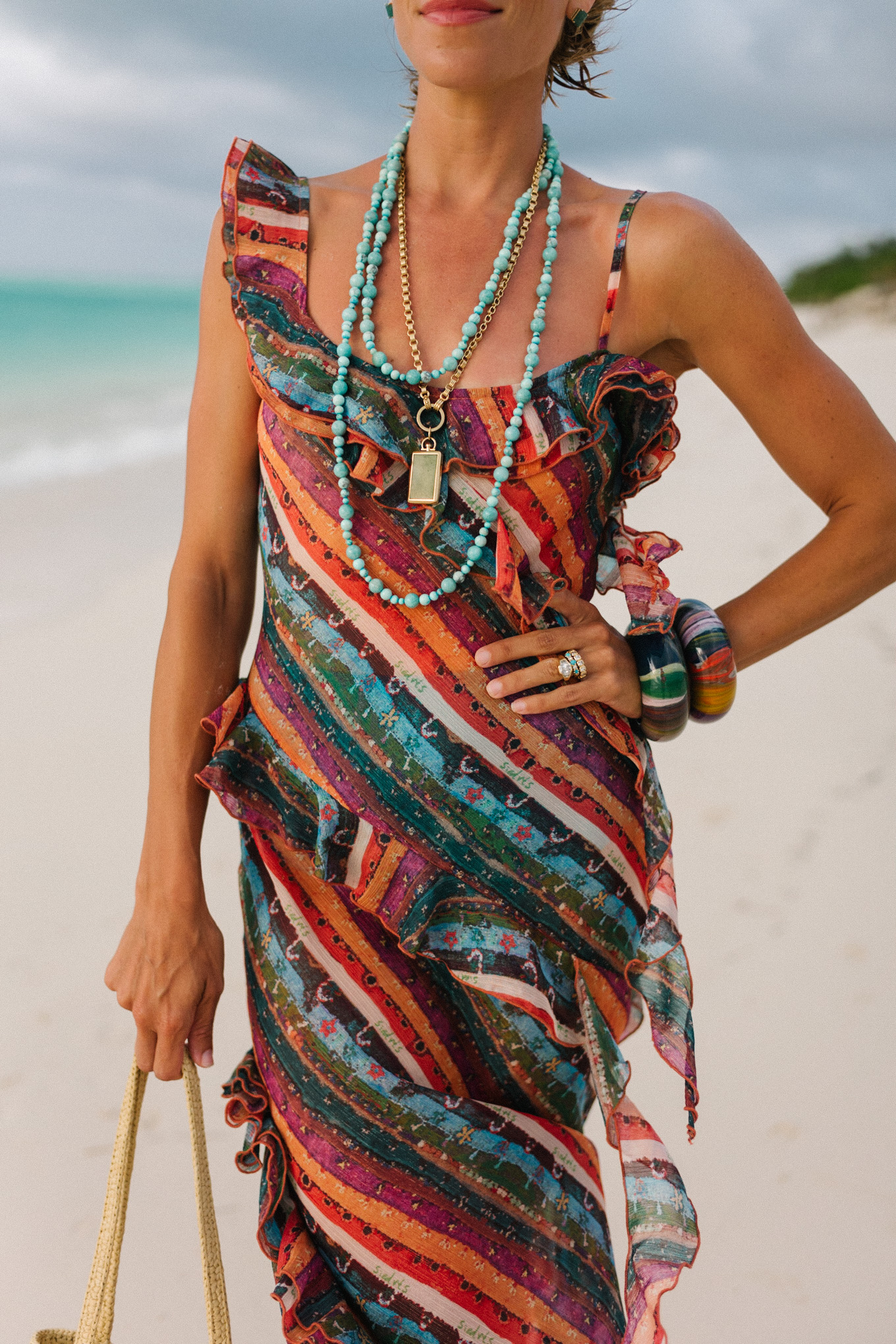 Rainbow stripe ruffle maxi dress turquoise bead necklace woven bag