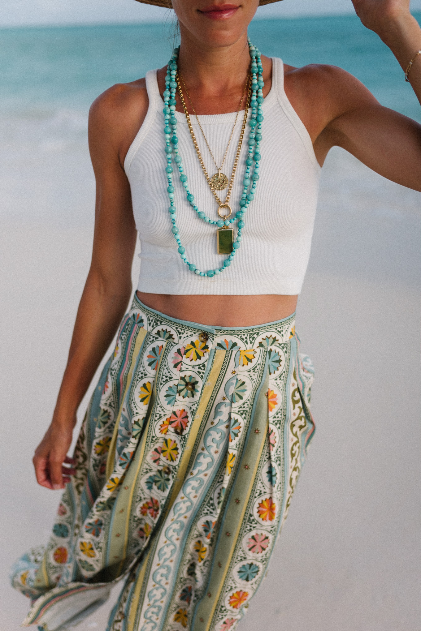 Floral skirt, white tank top, turquoise jewelry