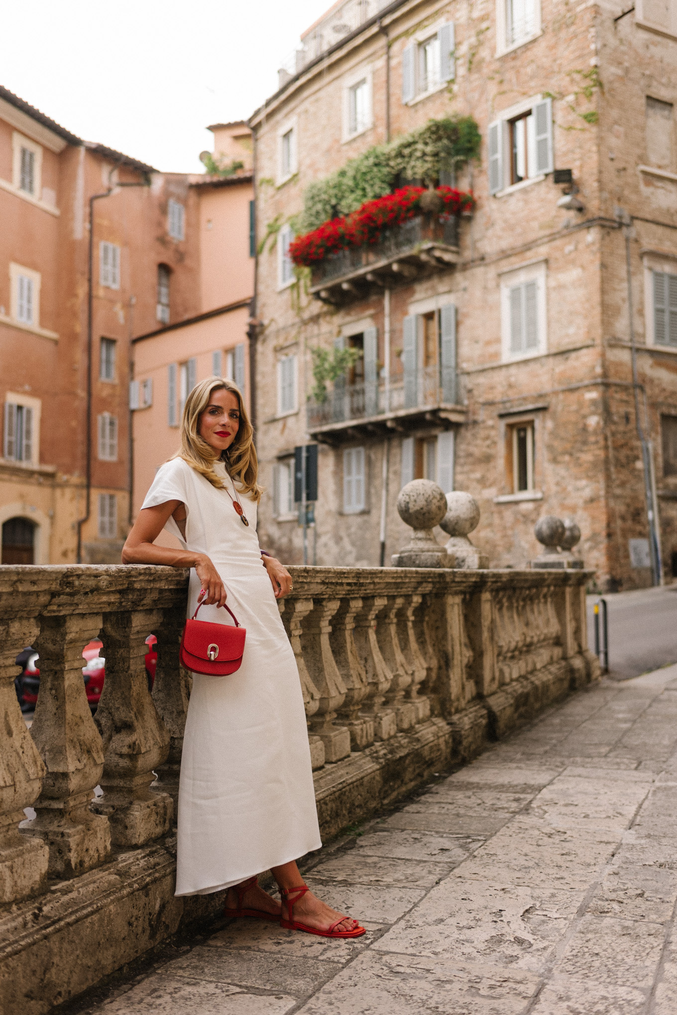white midi dress red bag red shoes statement jewelry
