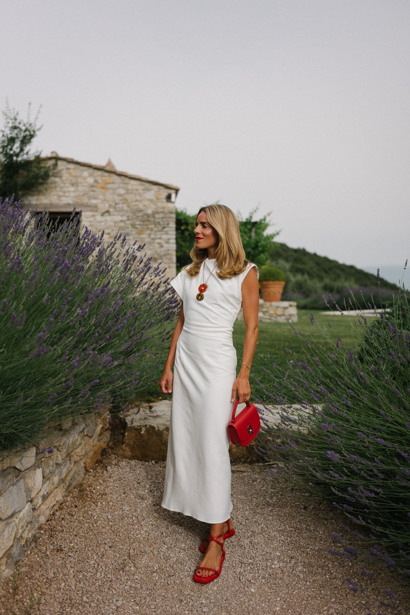 white midi dress red bag red shoes statement jewelry