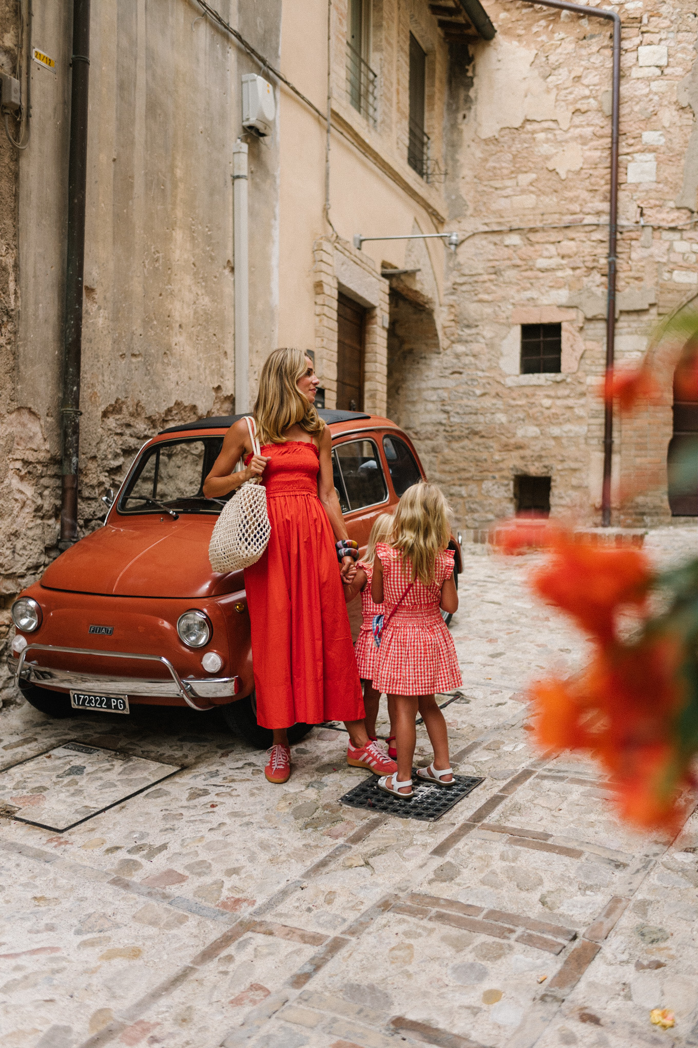 Red maxi dress, red sneakers, woven bag