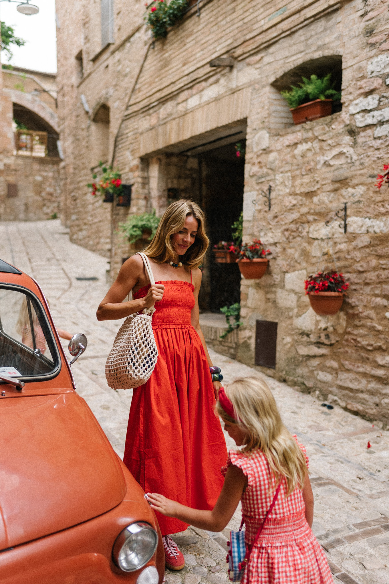 Red maxi dress, red sneakers, woven bag