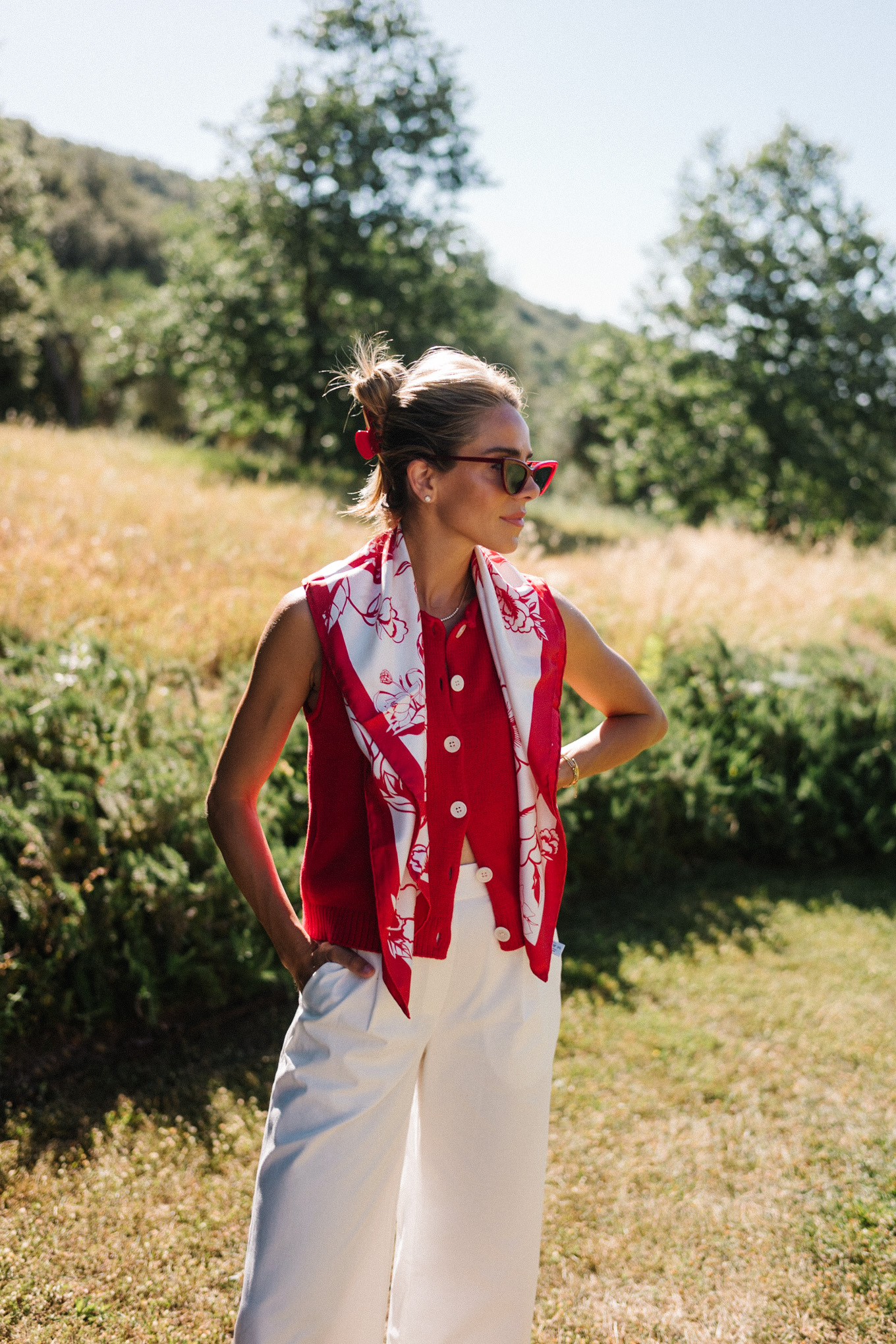 red sweater top white cotton pants straw bag red mesh shoes