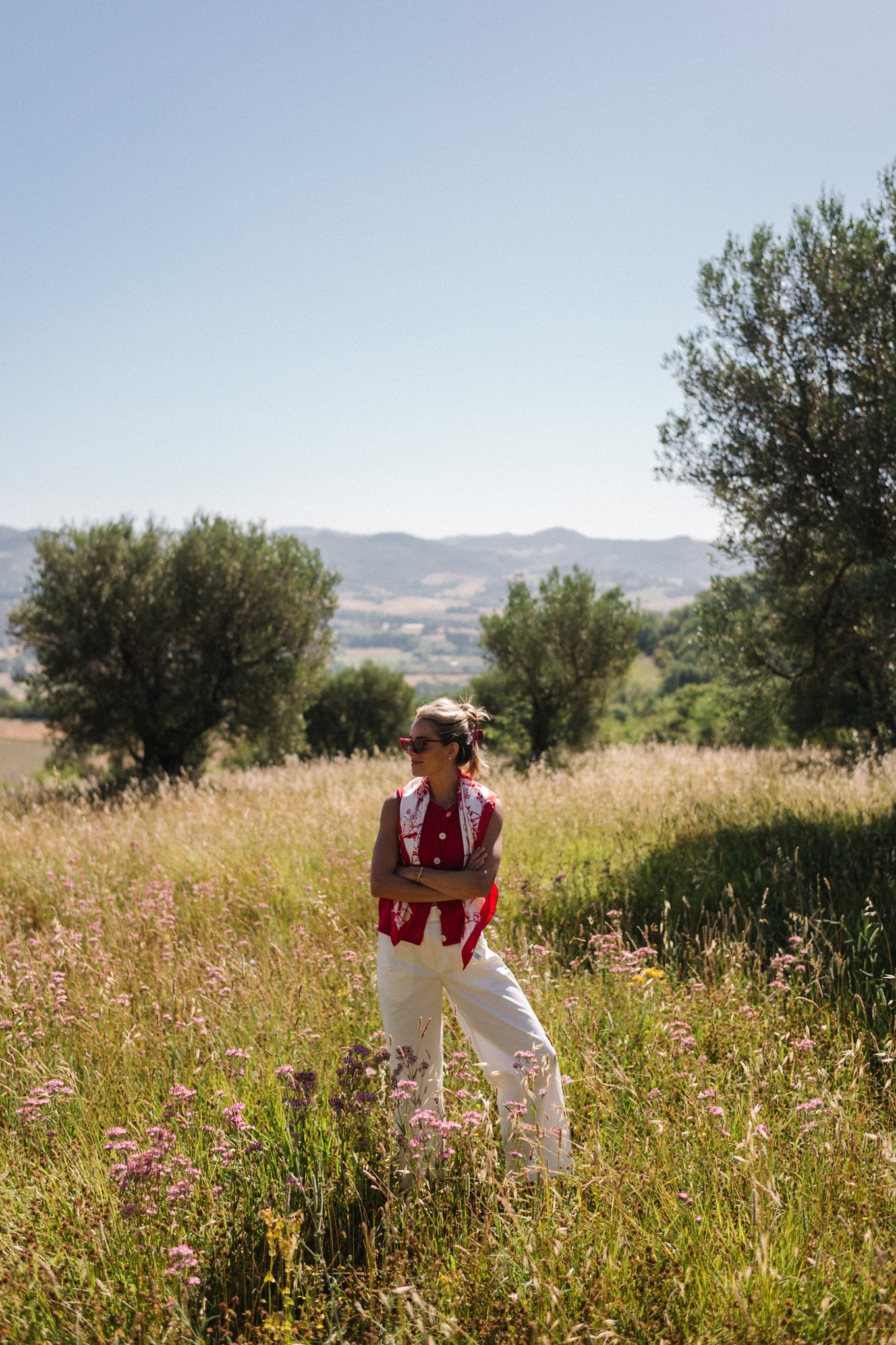 red sweater top white cotton pants straw bag red mesh shoes