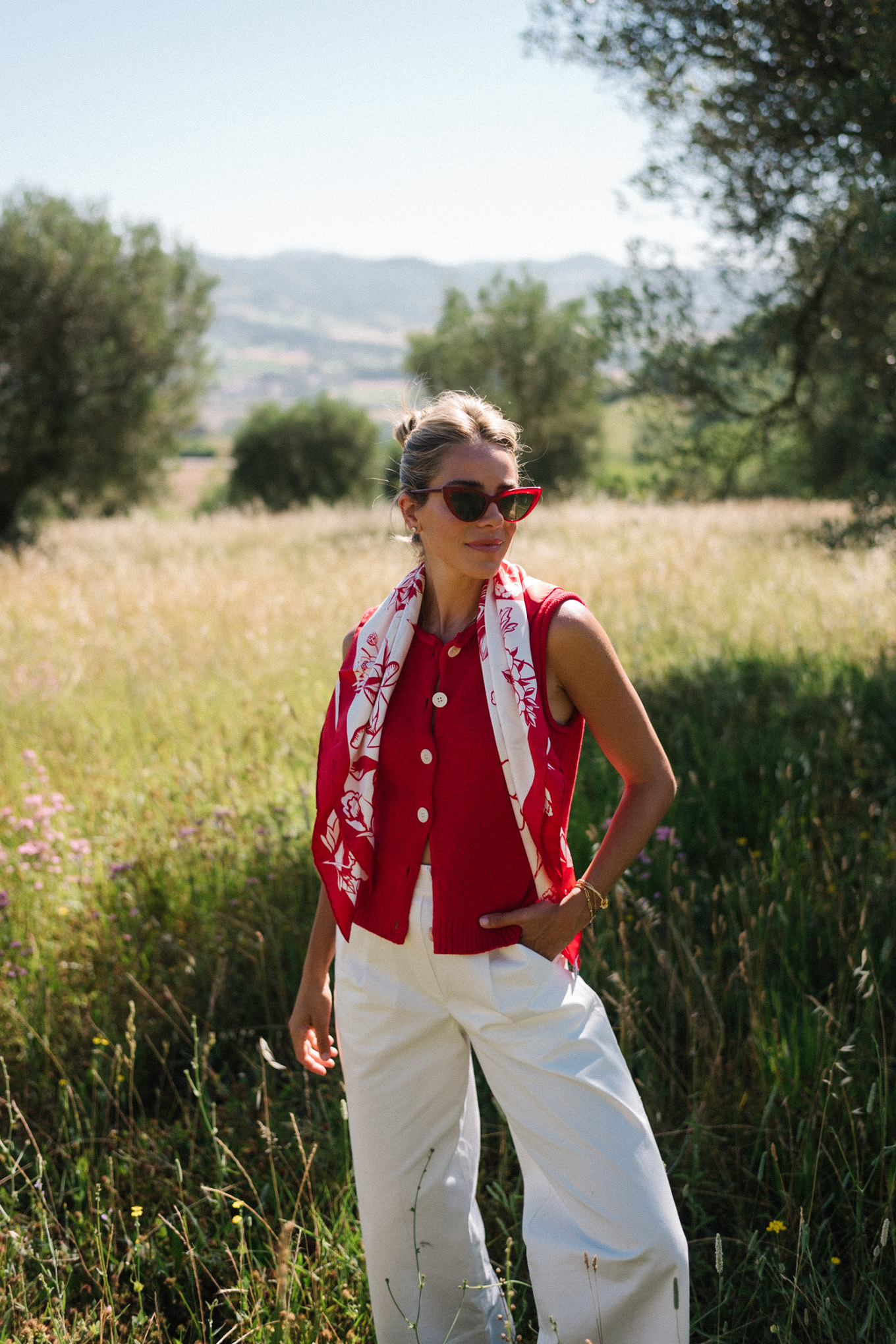 red sweater top white cotton pants straw bag red mesh shoes