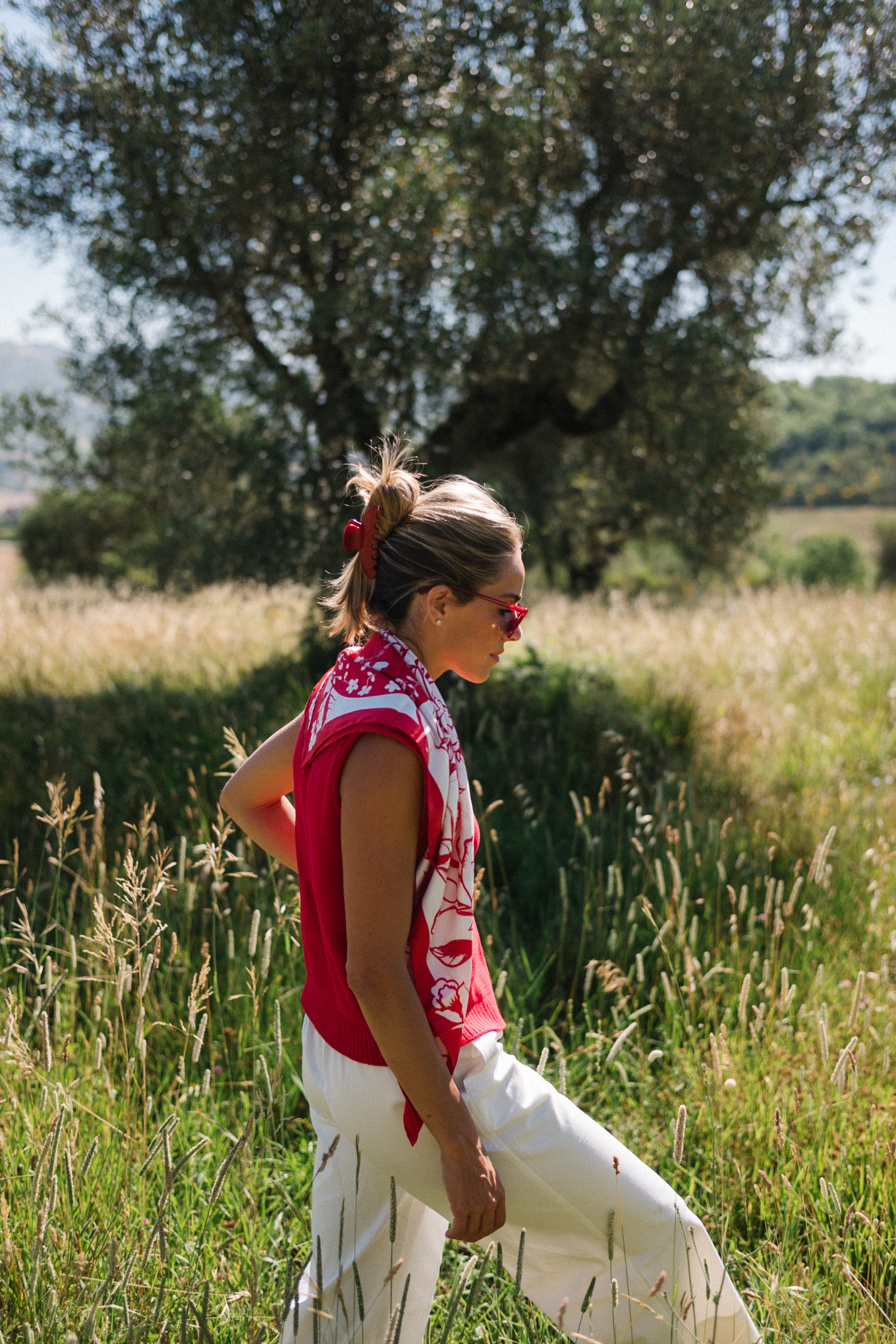 red sweater top white cotton pants straw bag red mesh shoes