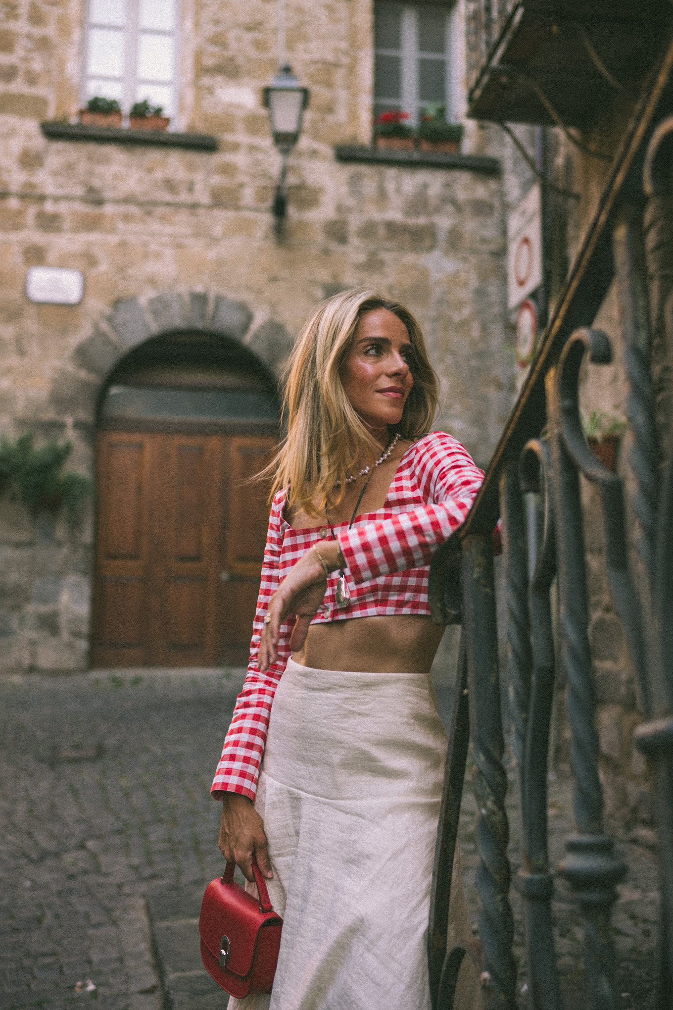 Red and white gingham crop top, white maxi skirt, red leather bag