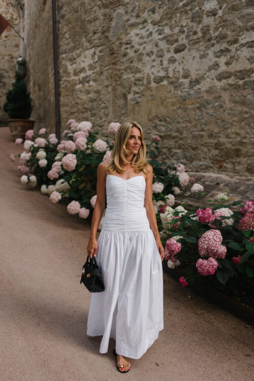 white maxi dress black leather sandals black straw bag