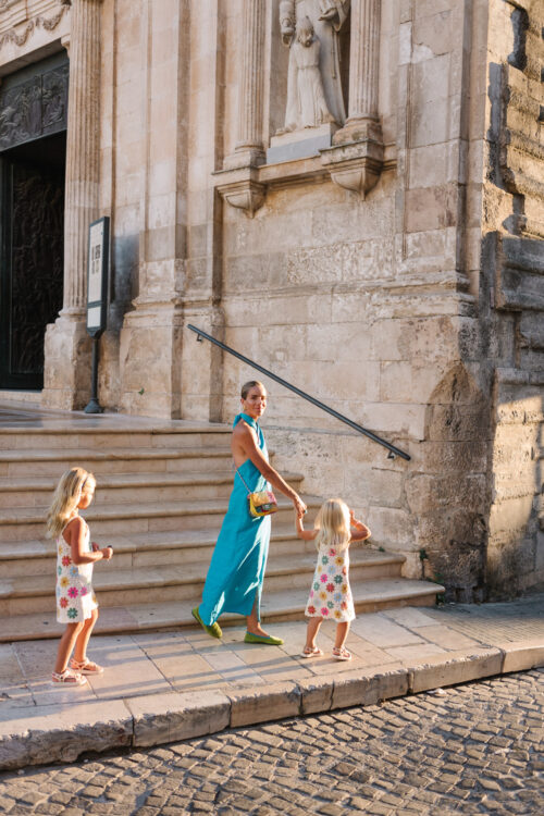 turquoise maxi dress green flats colorful bag
