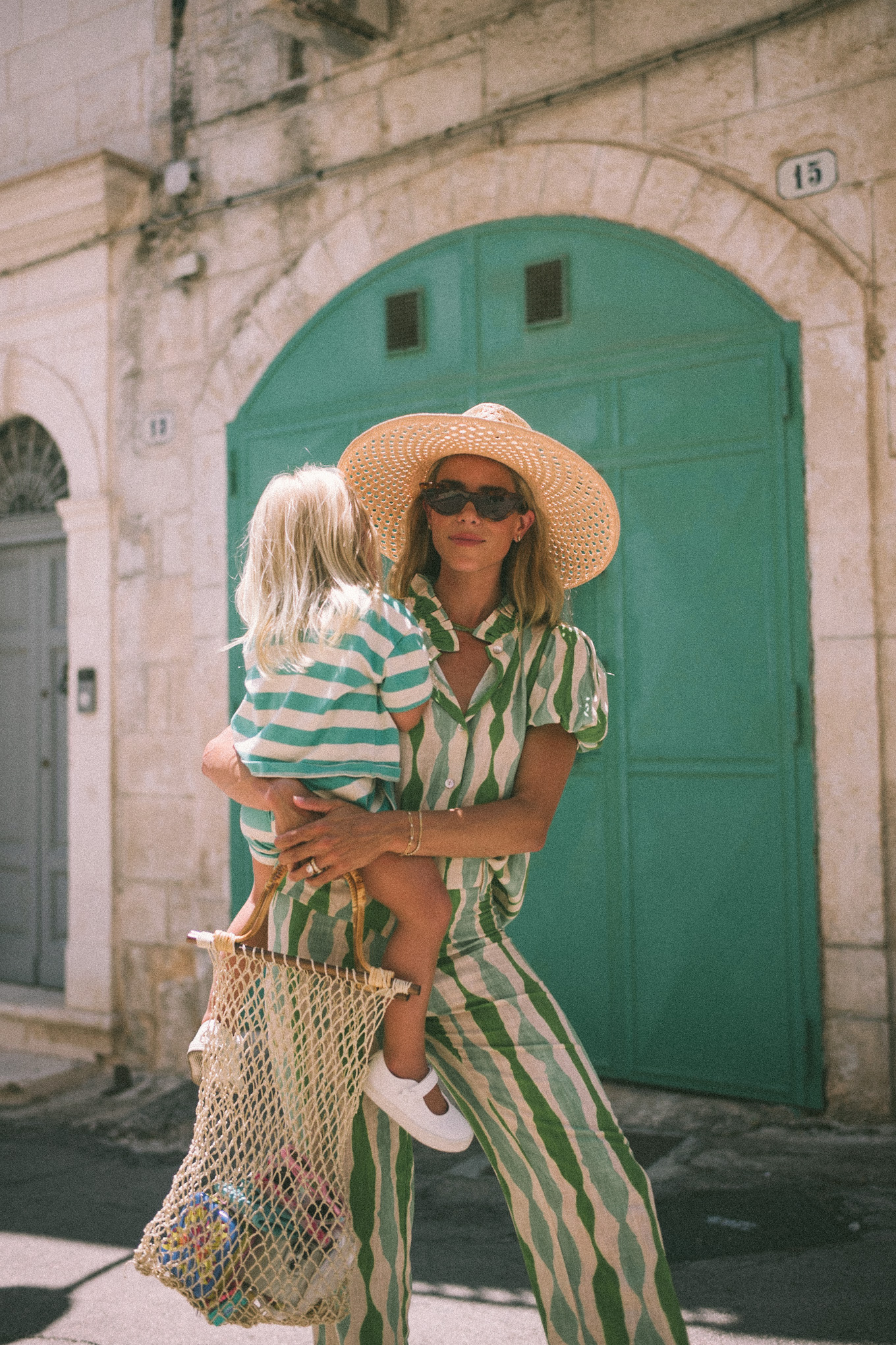 Green striped shirt and trousers, straw hat