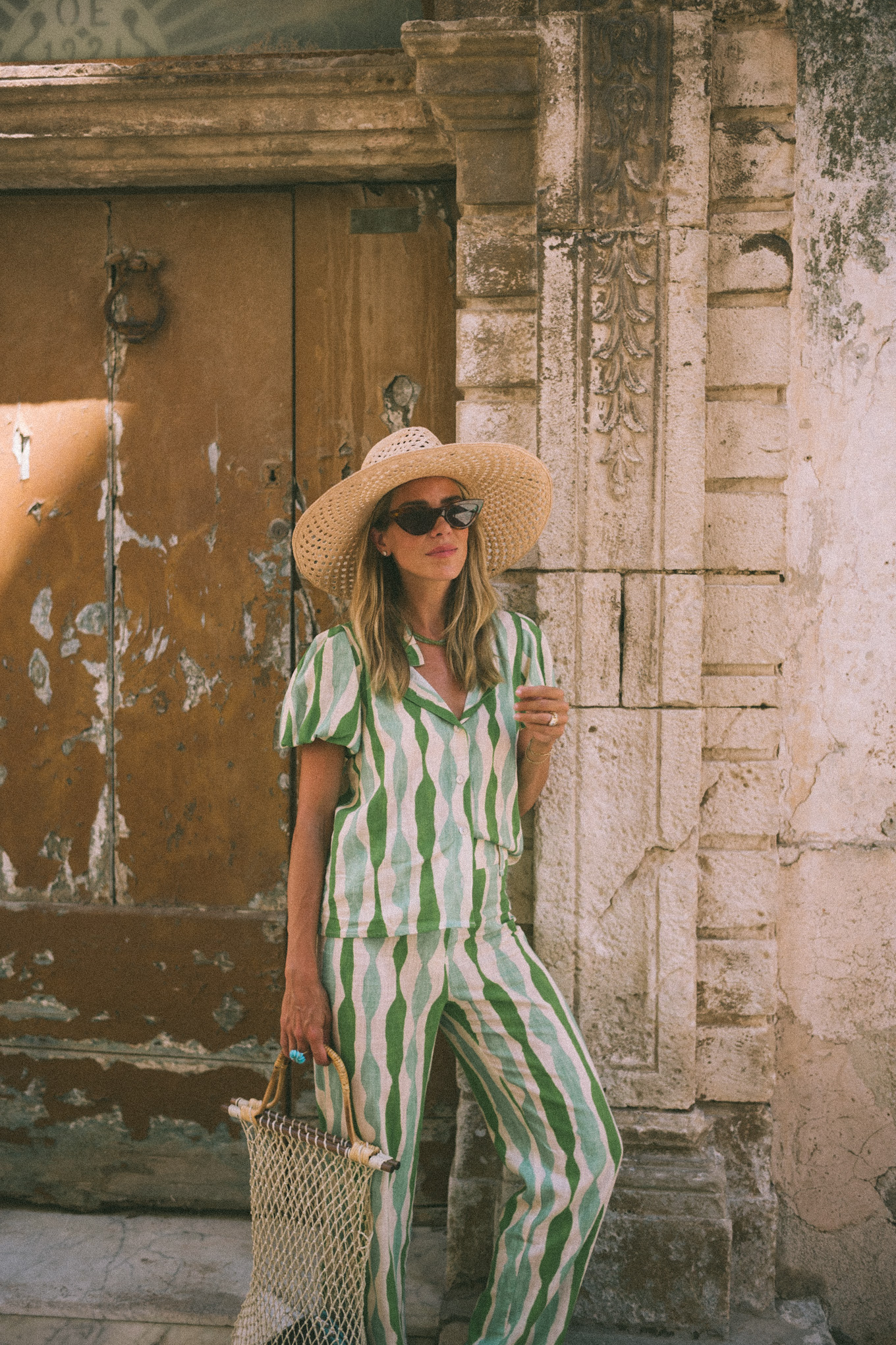 Green striped shirt and trousers, straw hat