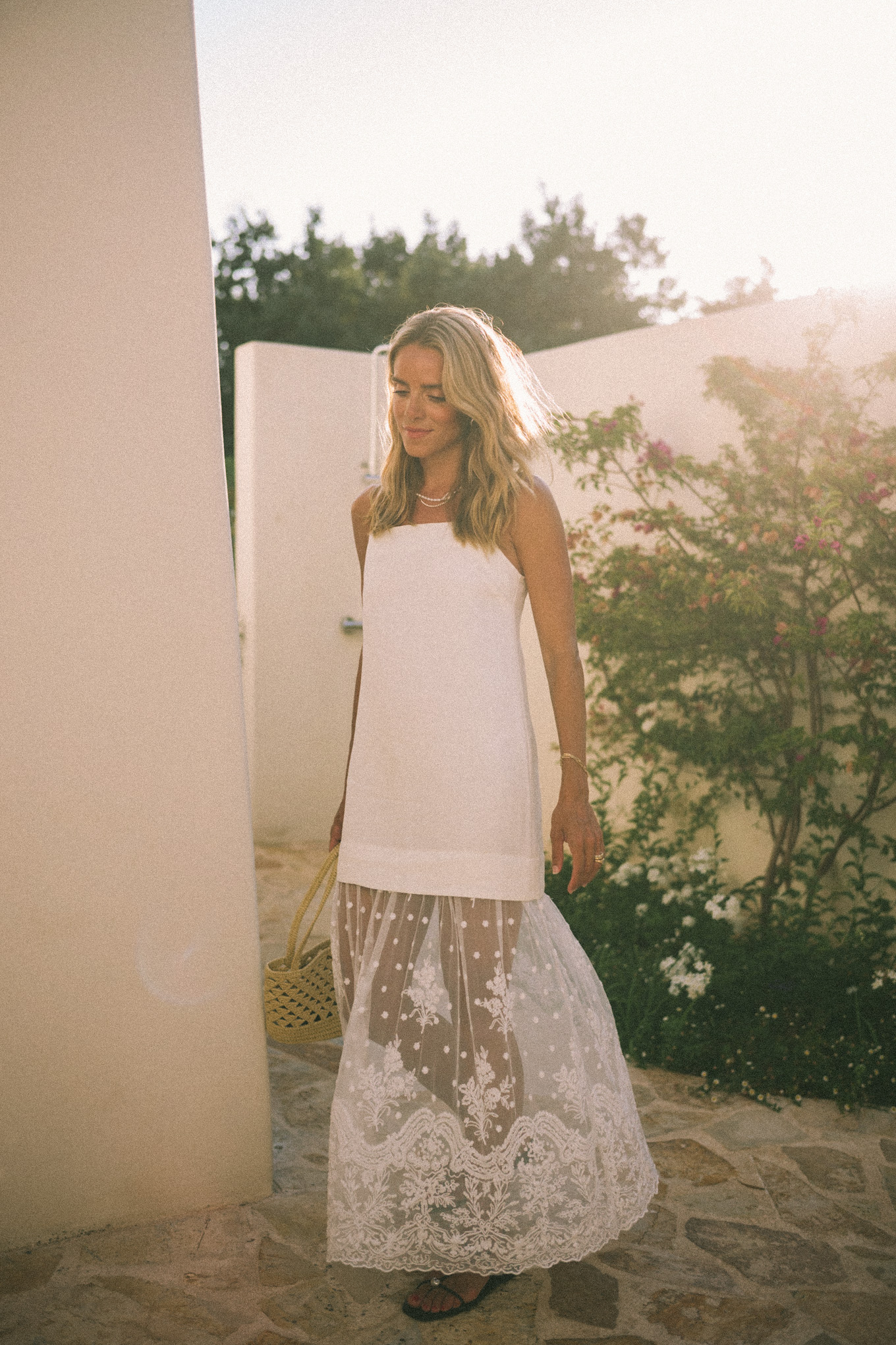 White mesh maxi dress, straw bag and leather sandals