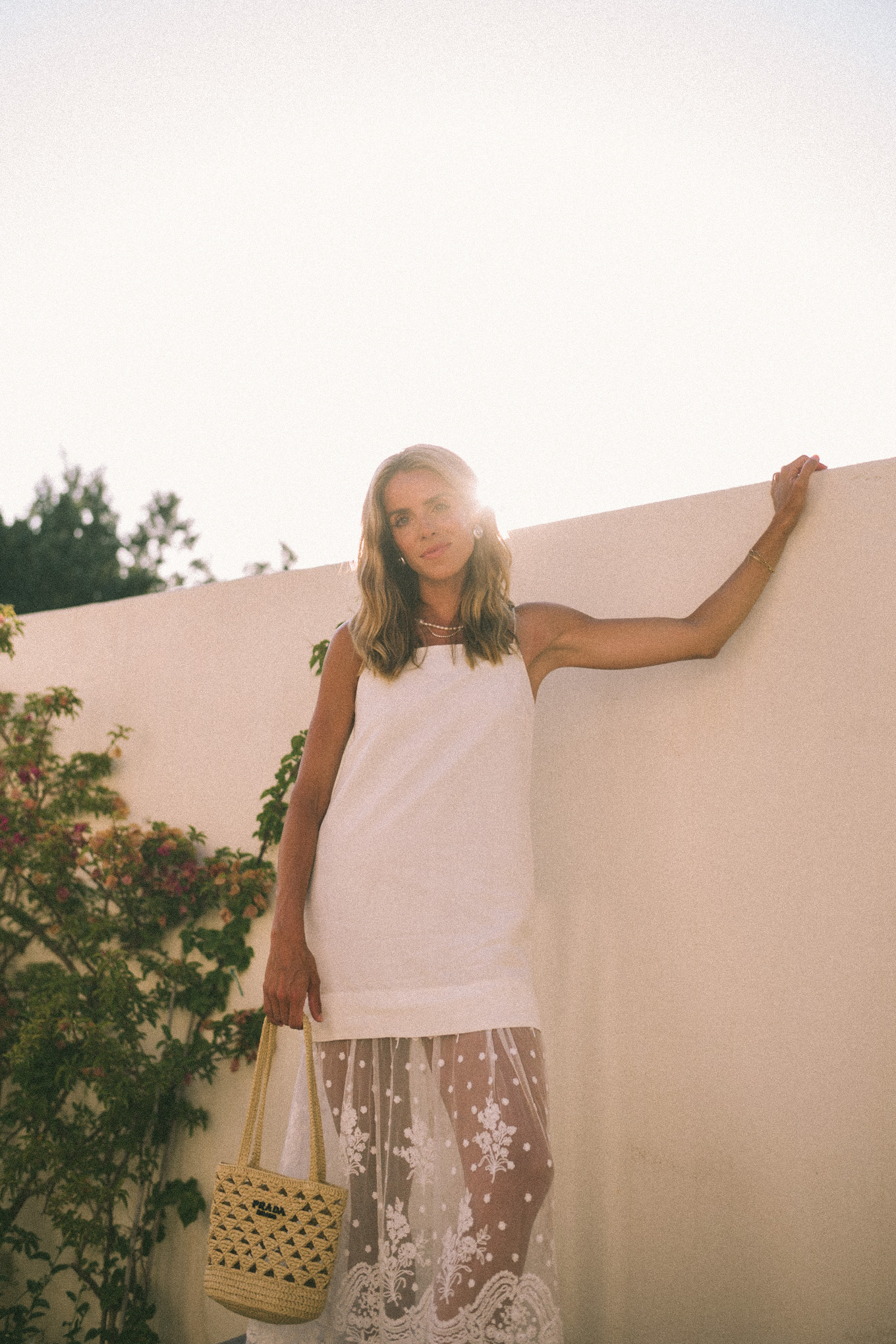 White mesh maxi dress, straw bag and leather sandals