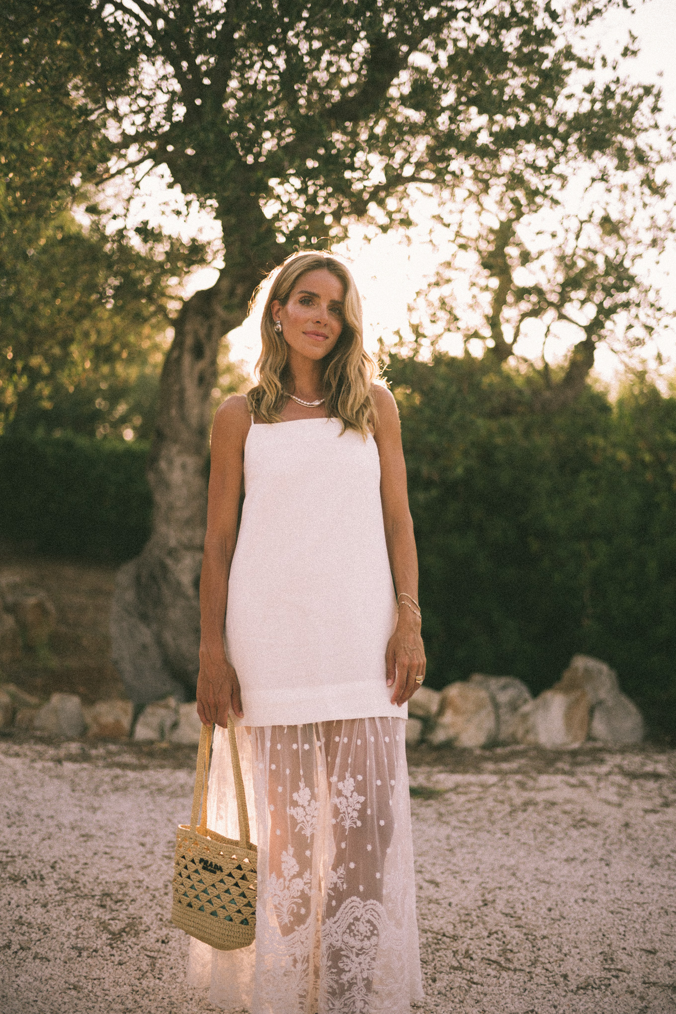 White mesh maxi dress, straw bag and leather sandals