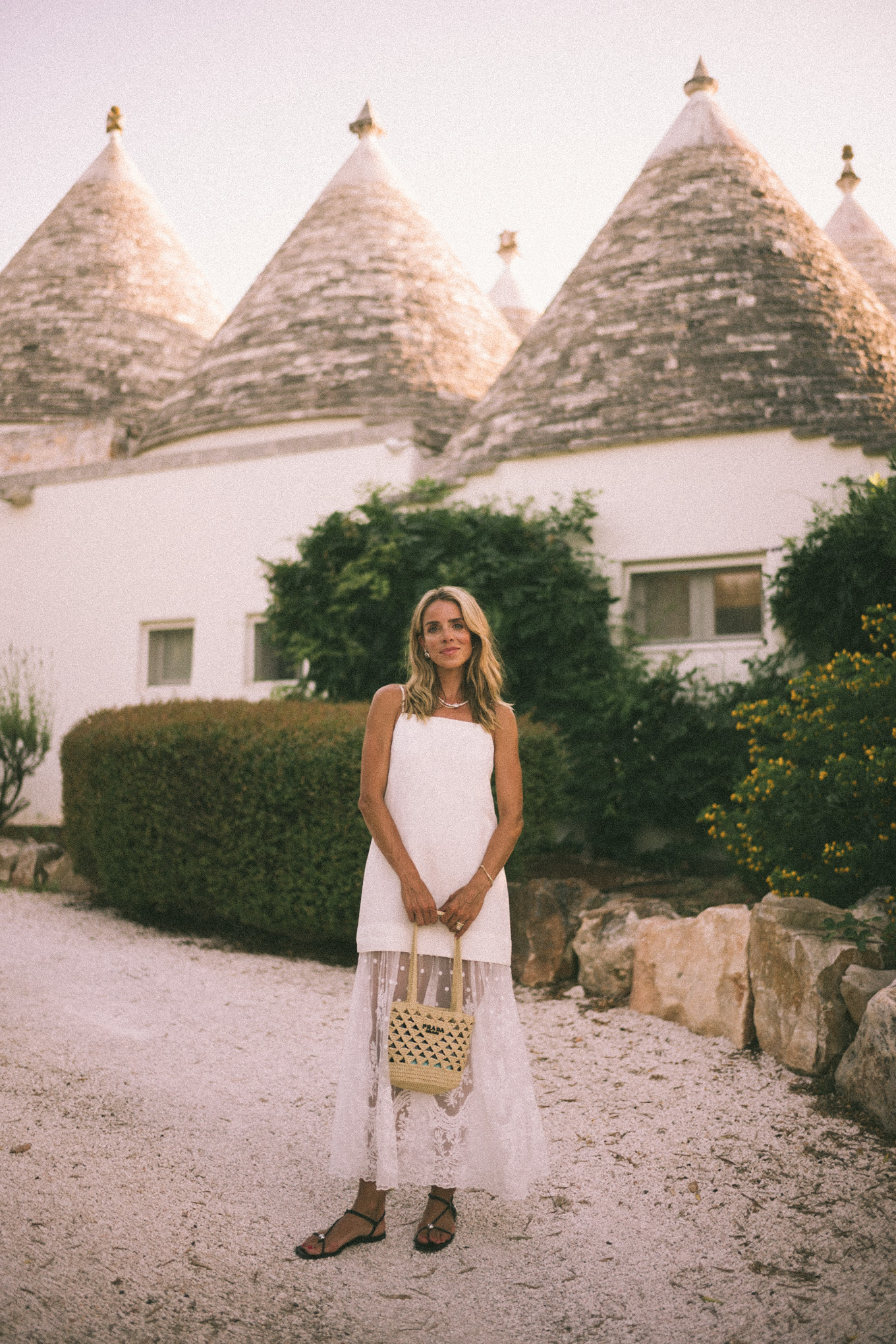 White mesh maxi dress, straw bag and leather sandals